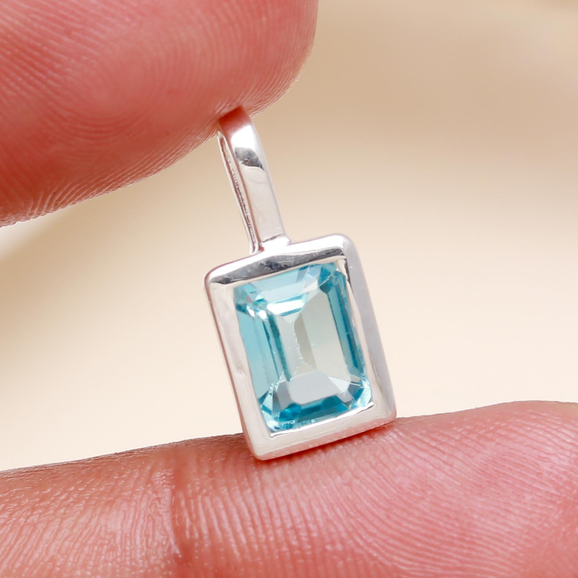 The Azure Prism: Blue Topaz Silver Charm