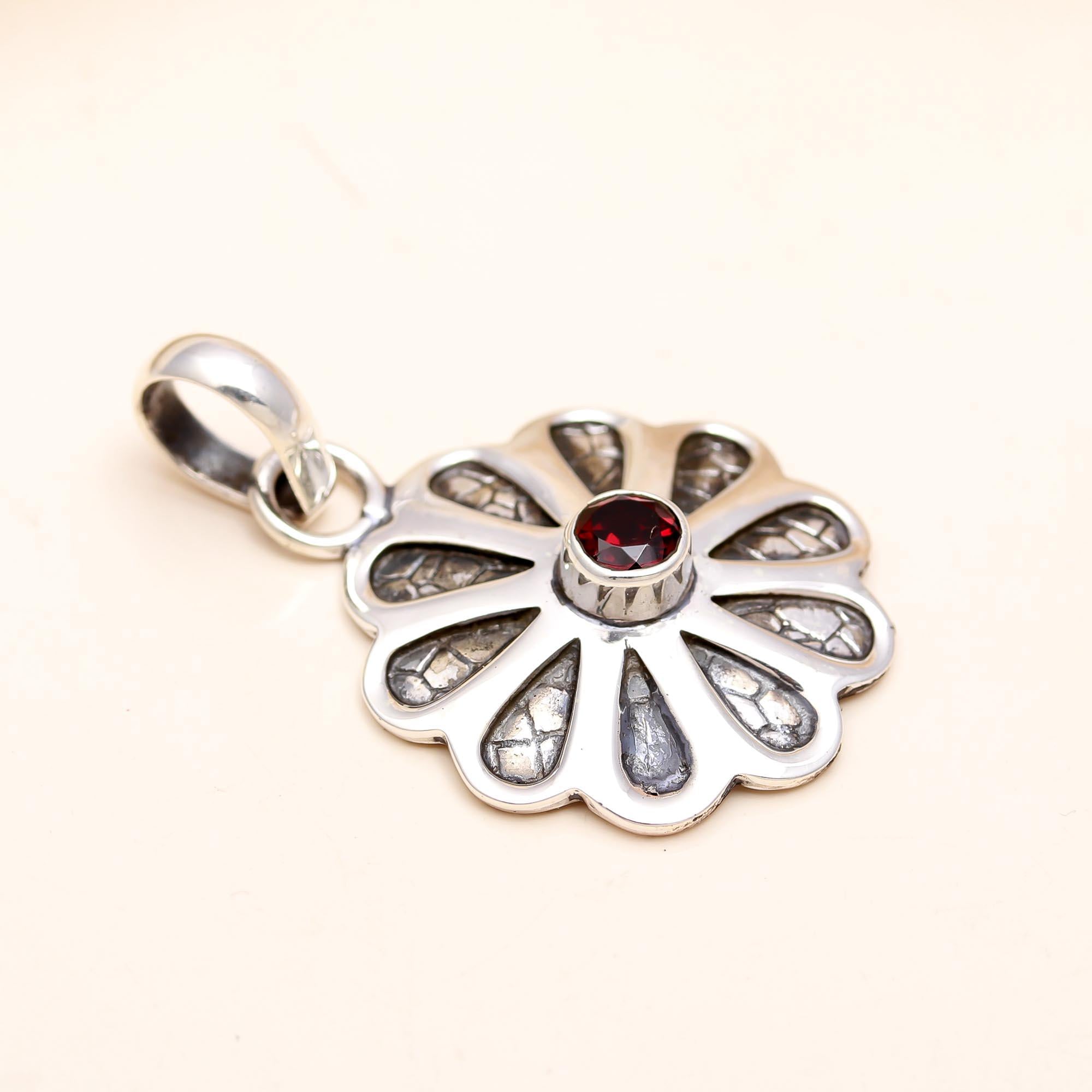 The Textured Blossom Pendant: Textured Silver Garnet Flower Pendant