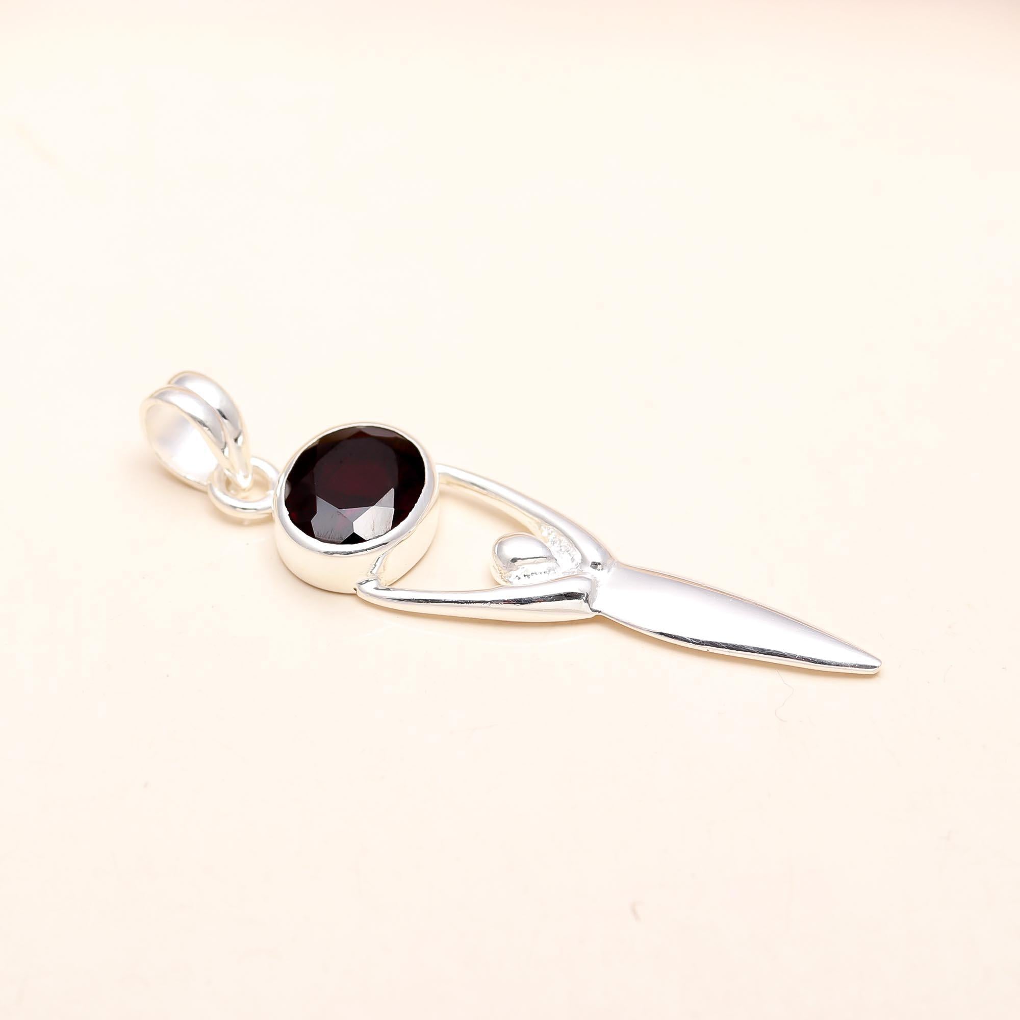 The Abstract Goddess Pendant: Stylized Garnet Figure Pendant