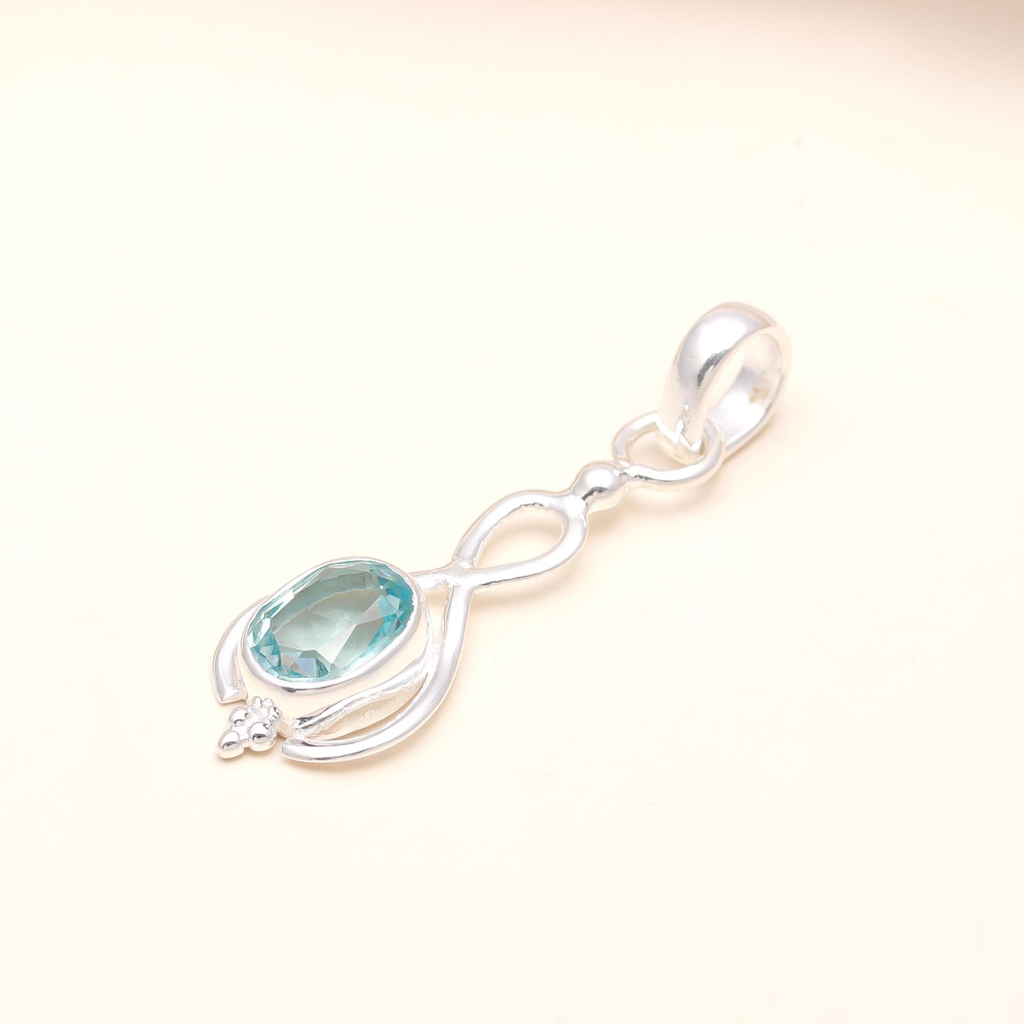 The Azure Infinity: Blue Topaz Elegant Loop Pendant
