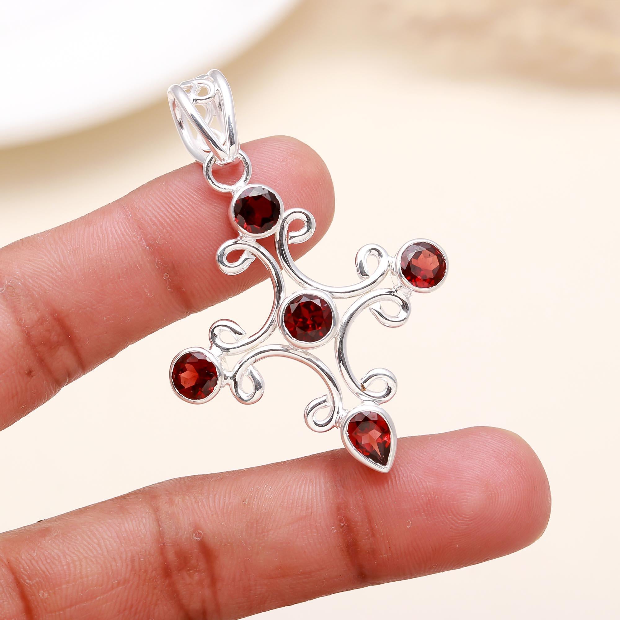 A Jewels Classy Cross Garnet Pendant