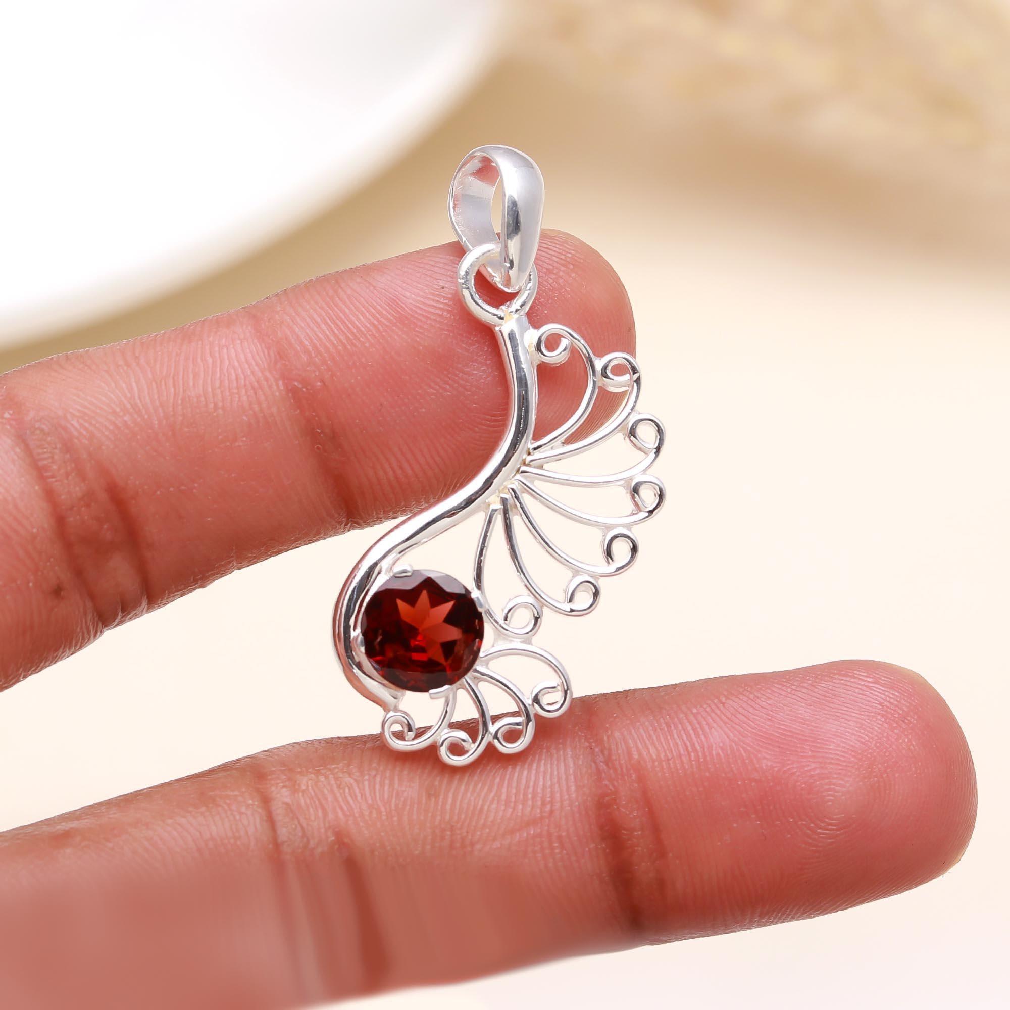 The Peacock Flame: Garnet Filigree Scroll Silver Pendant