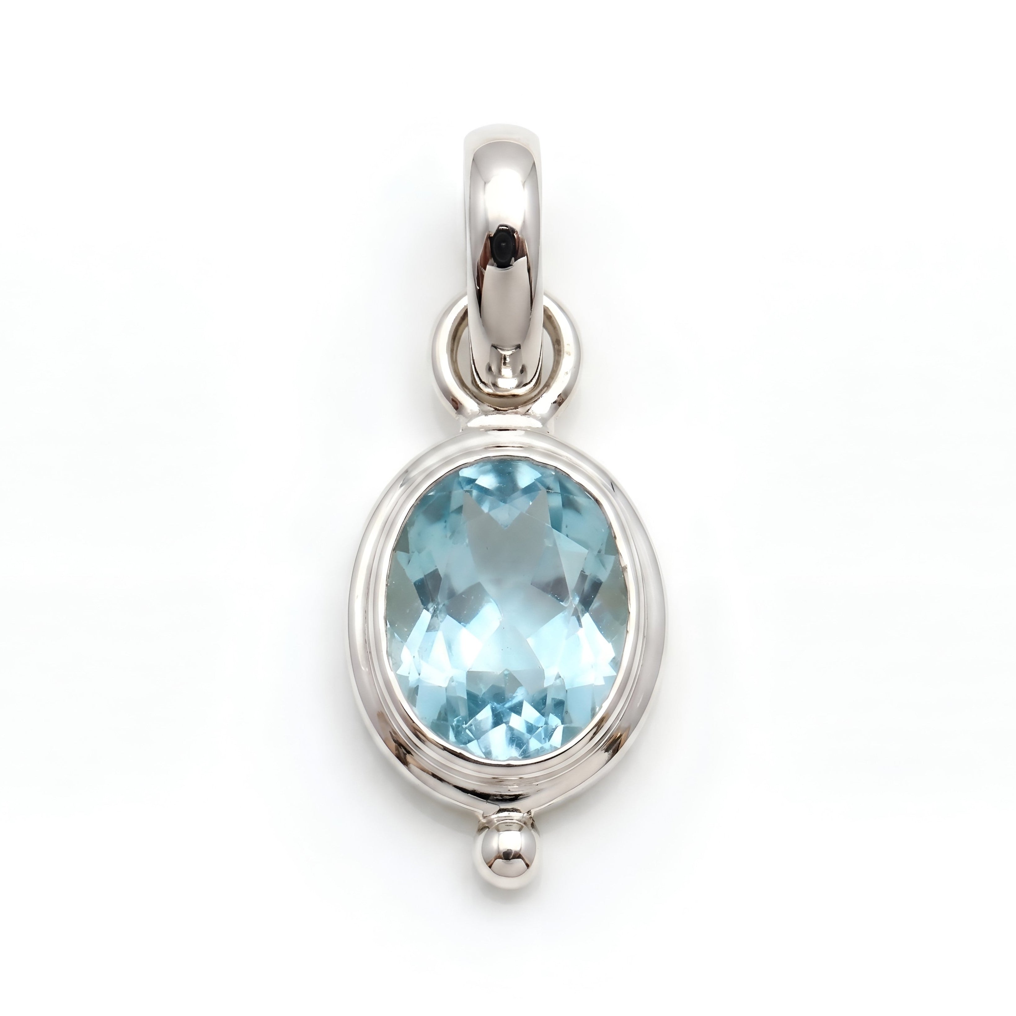 The Sky Drop: Oval Blue Topaz Dainty Bezel Silver Pendant