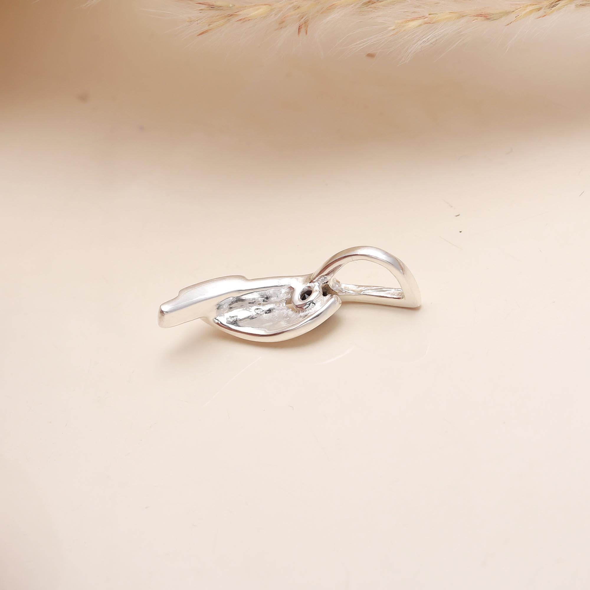 The Sculptural Fold: Silver & Sapphire Pendant