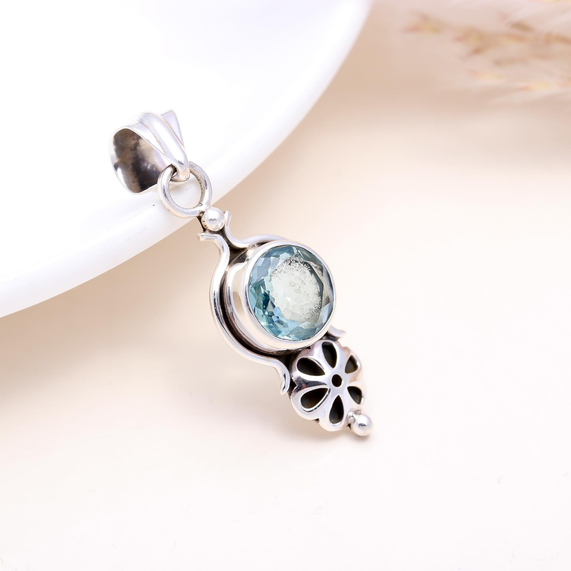 The Petal Cascade: Blue Topaz Articulated Pendant