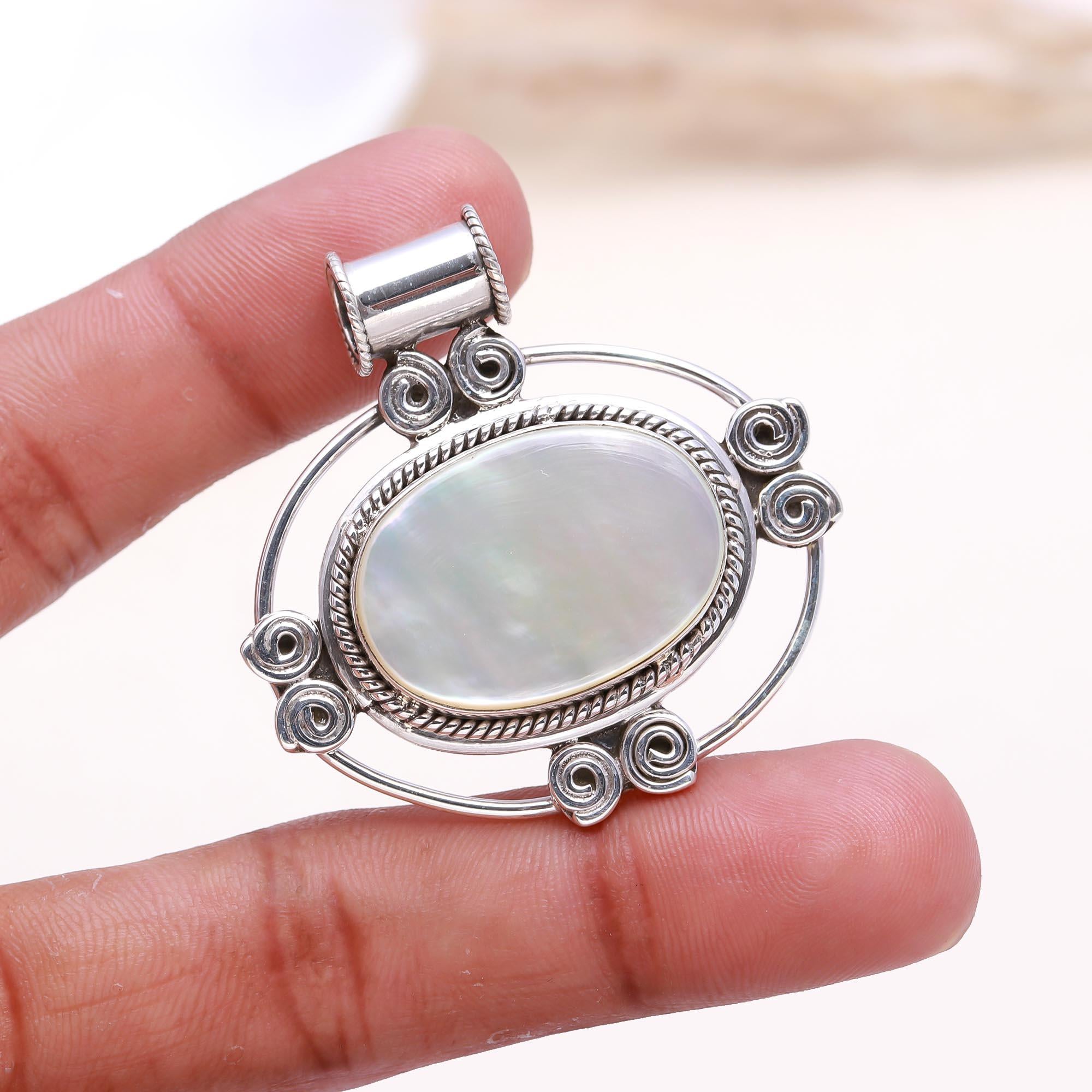 The White Pearl Essence: Mother of Pearl Scrollwork Pendant
