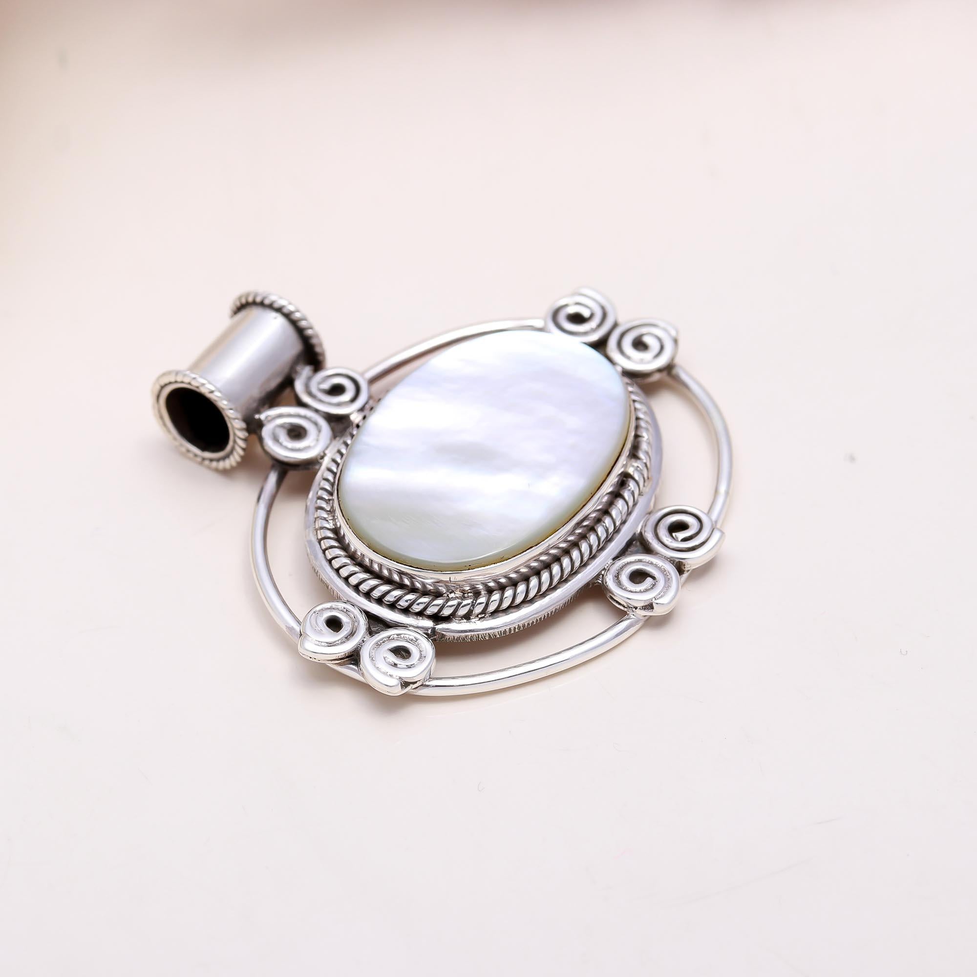 The White Pearl Essence: Mother of Pearl Scrollwork Pendant