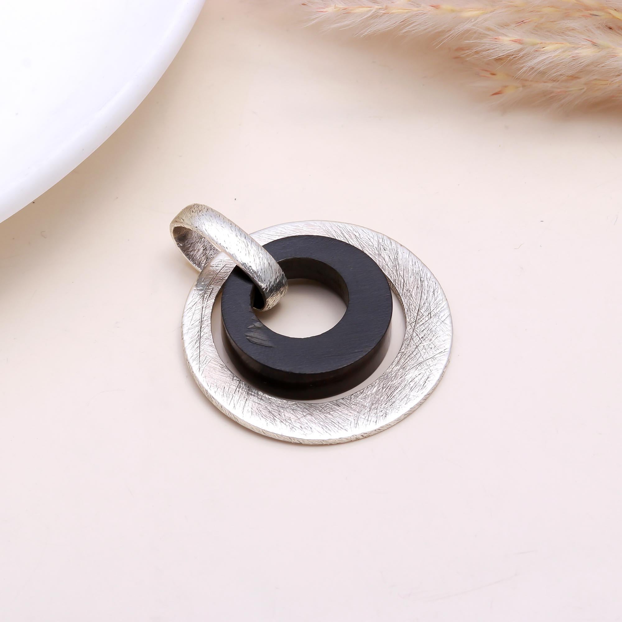 The Modern Halo Title: Silver & Black Wood Geometric Pendant