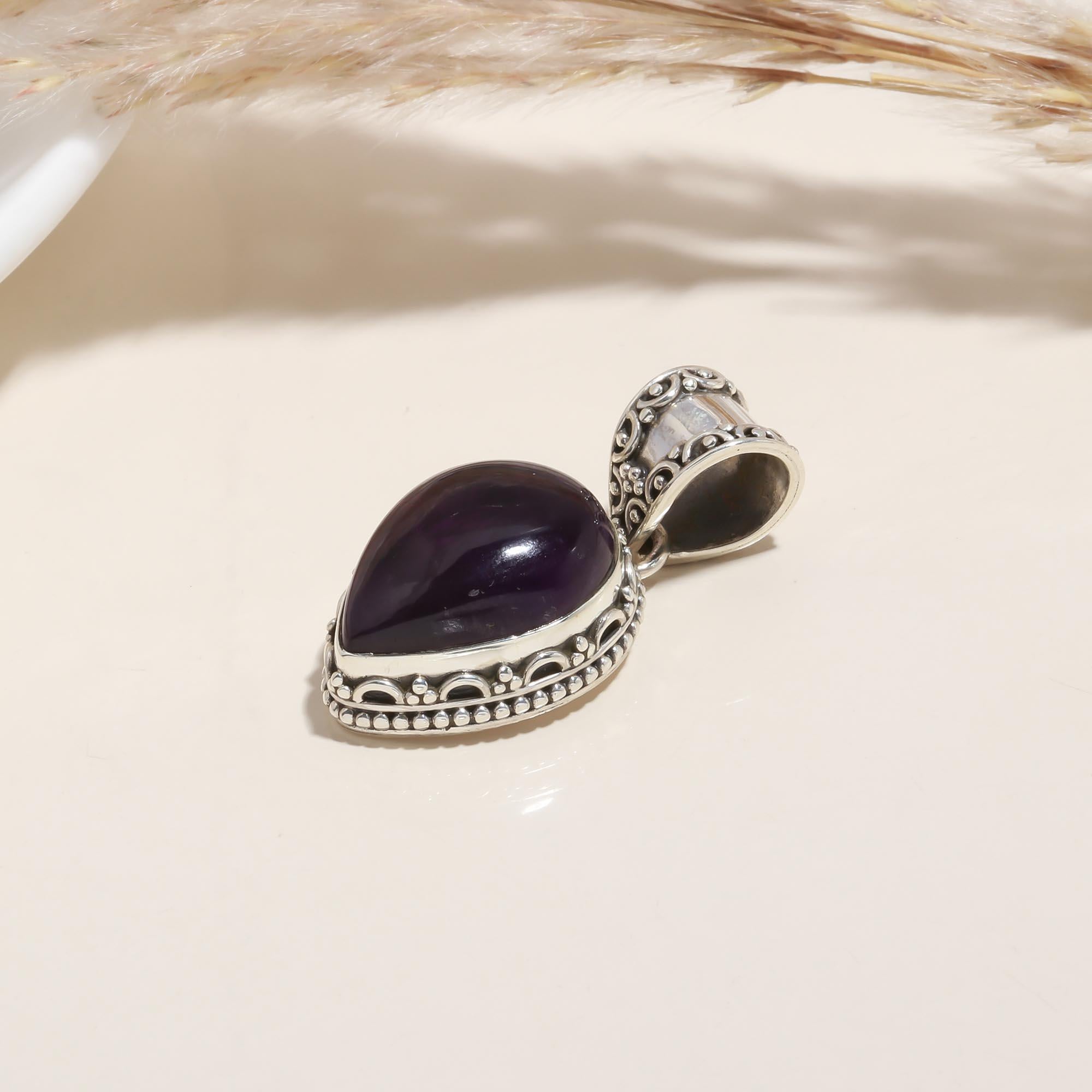 The Balinese Amethyst: Intricate Teardrop Silver Pendant