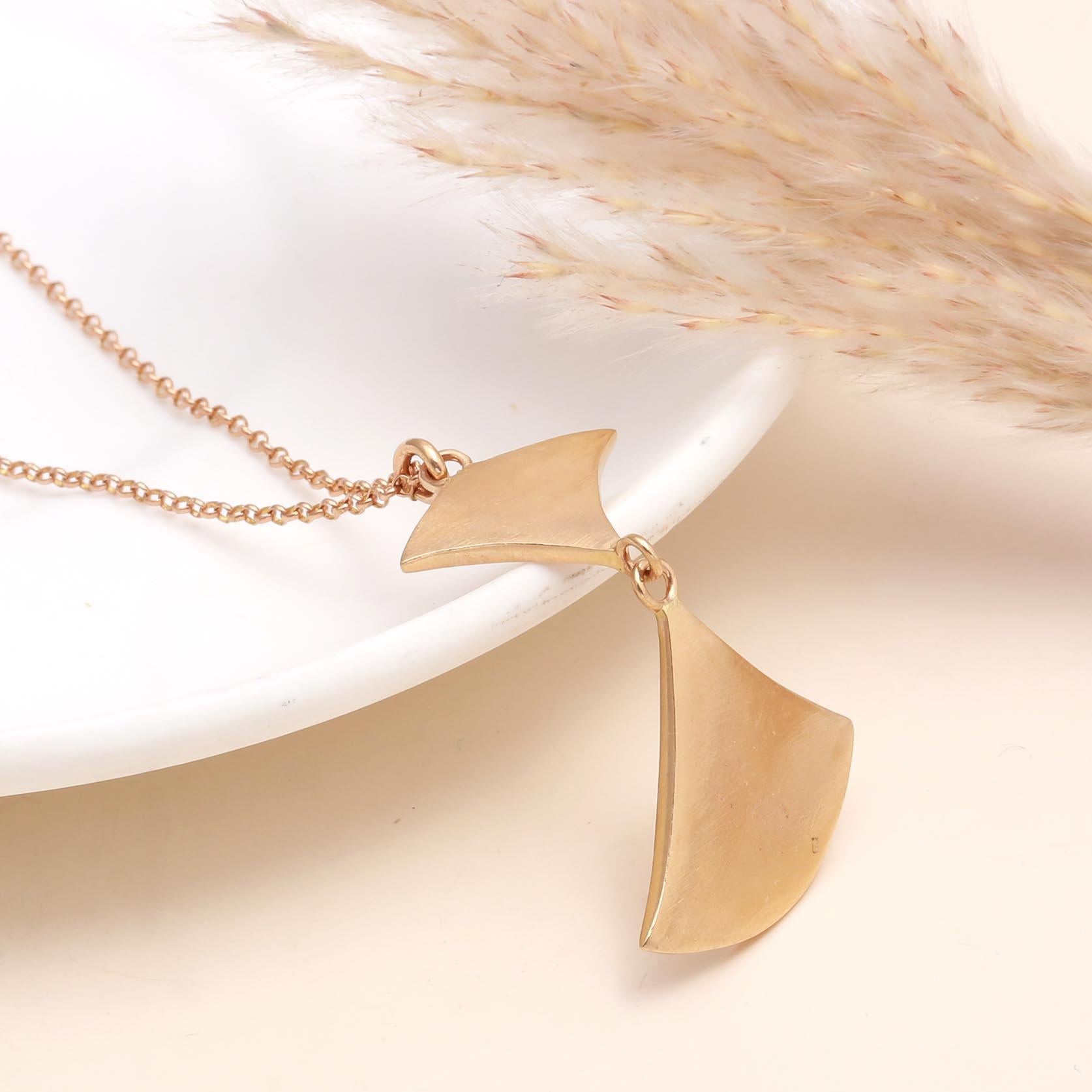 The Modern Wing: Geometric Gold Abstract Necklace