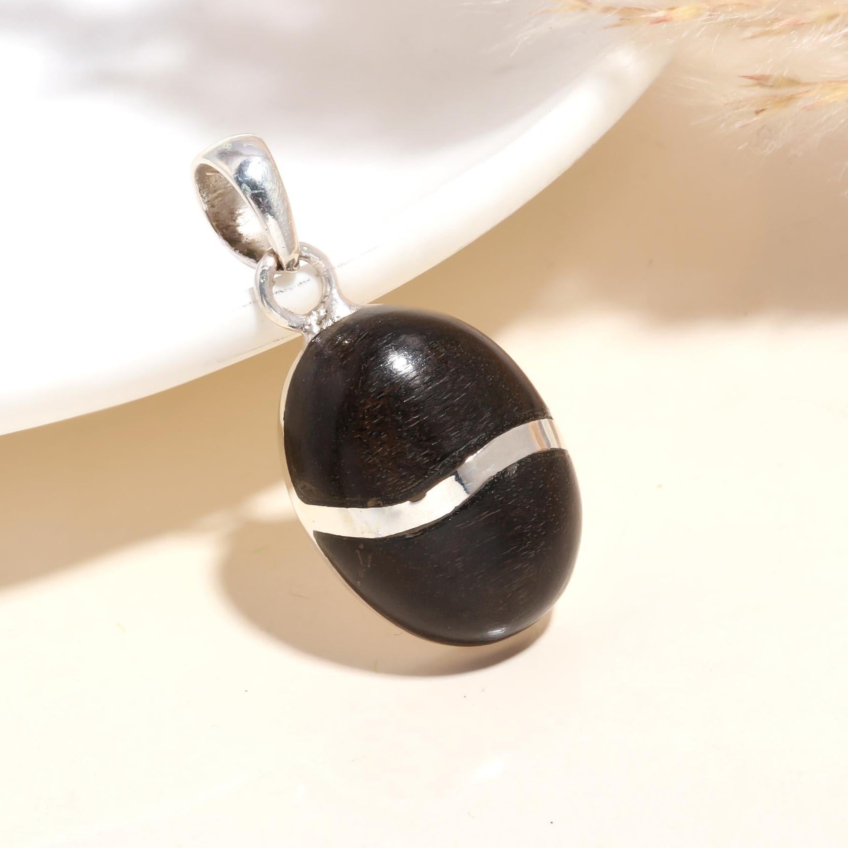 The Ebony Orb: Minimalist Silver Charm