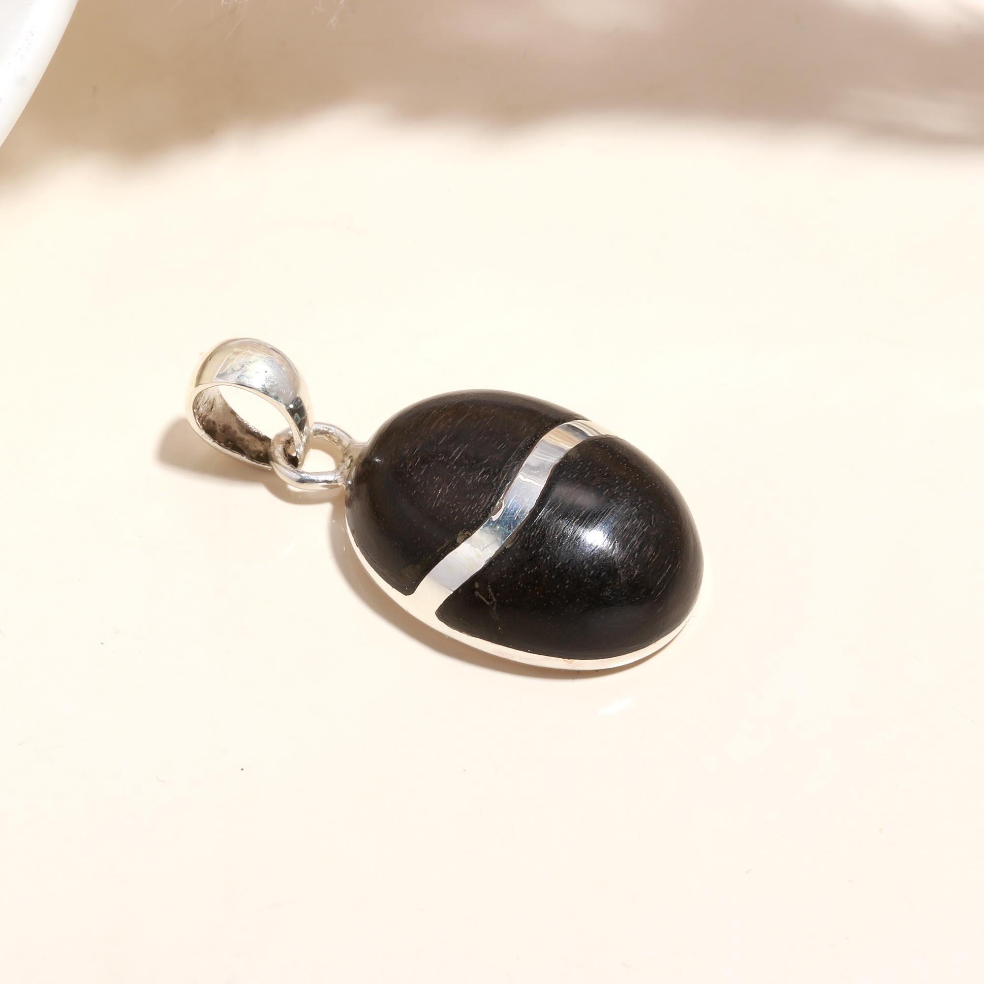 The Ebony Orb: Minimalist Silver Charm