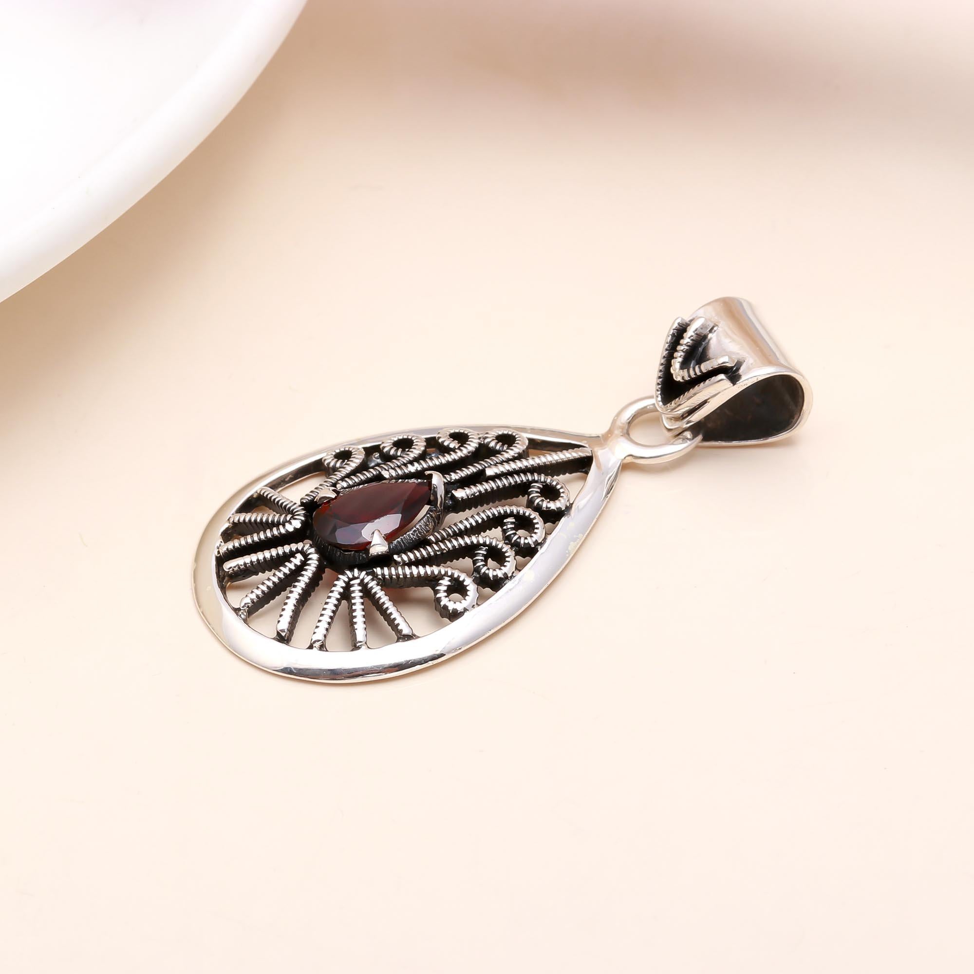 The Peacock Teardrop: Garnet Filigree Silver Pendant