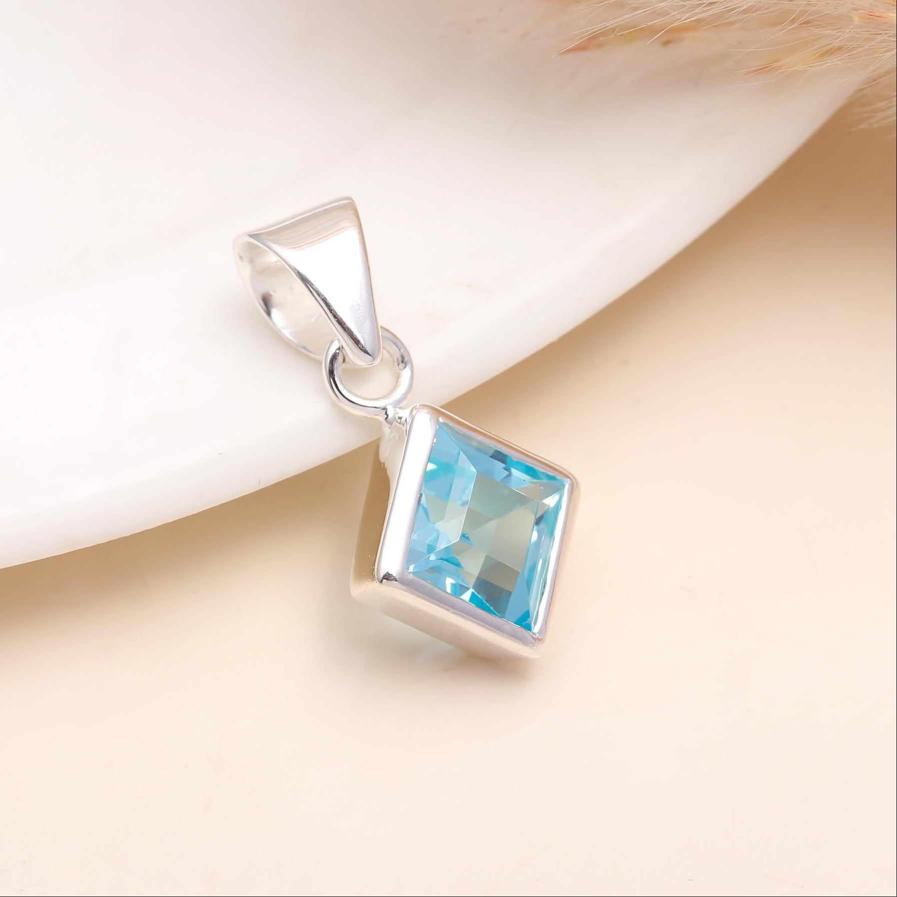 The Blue Tablet: Blue Topaz Silver Charm