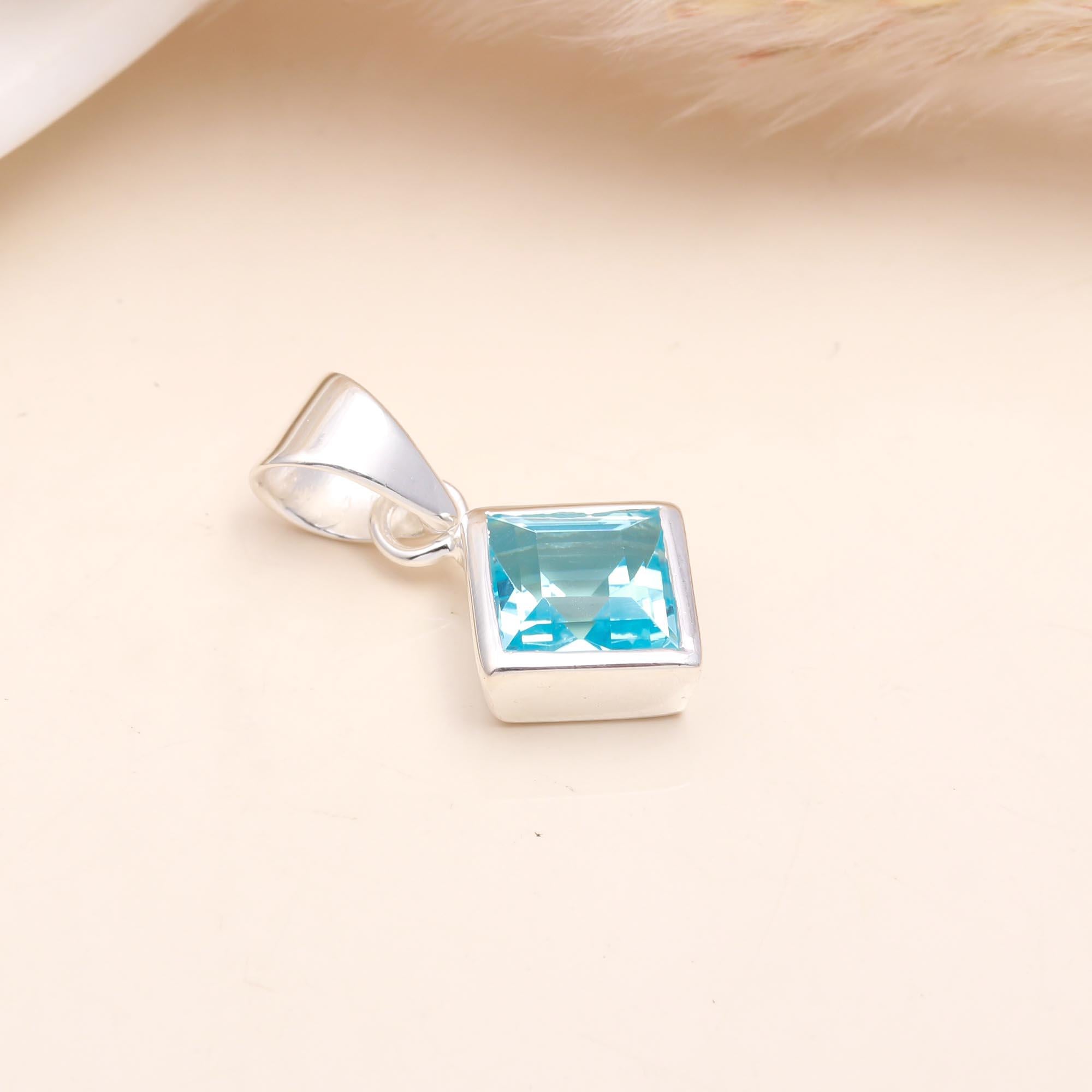 The Blue Tablet: Blue Topaz Silver Charm
