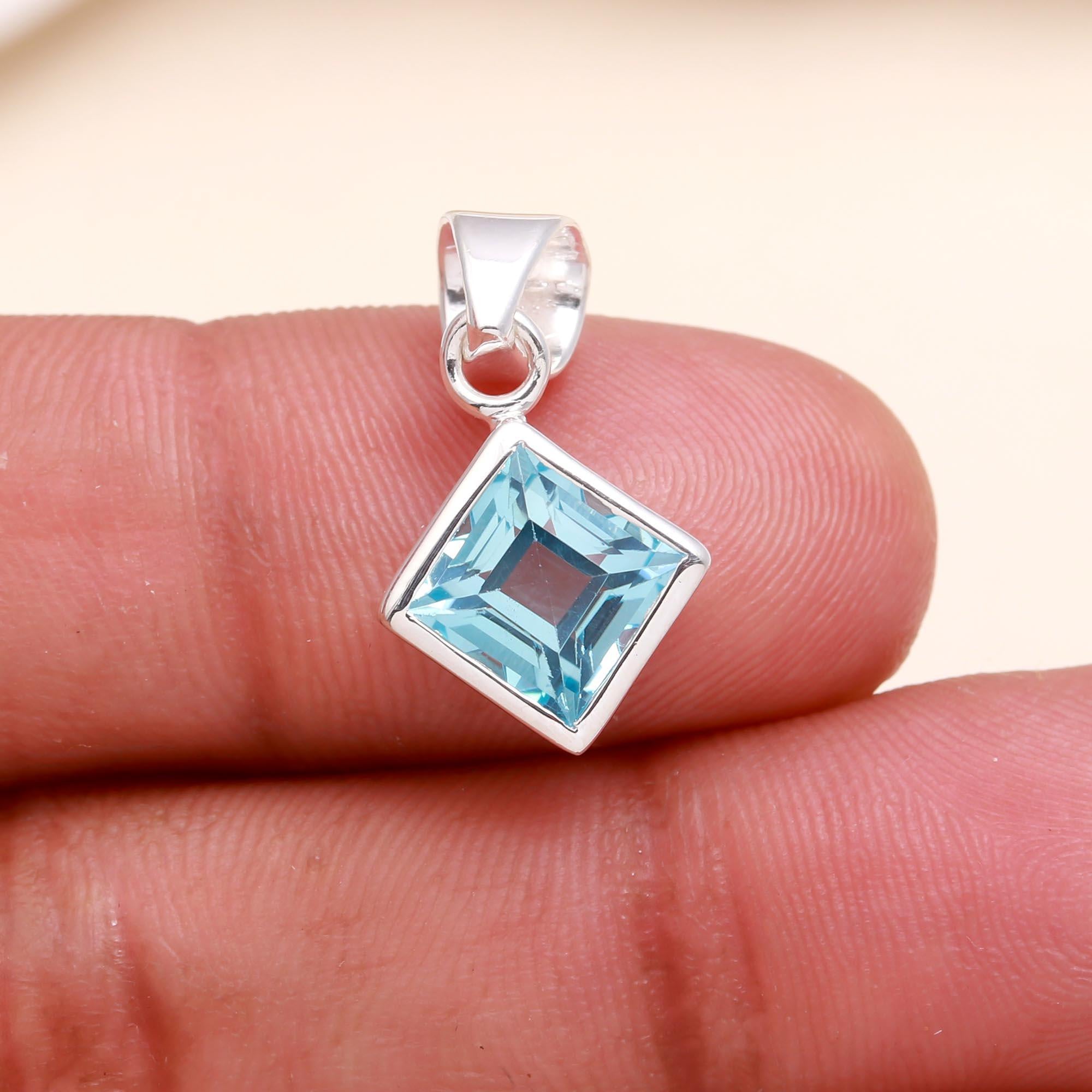 The Blue Tablet: Blue Topaz Silver Charm