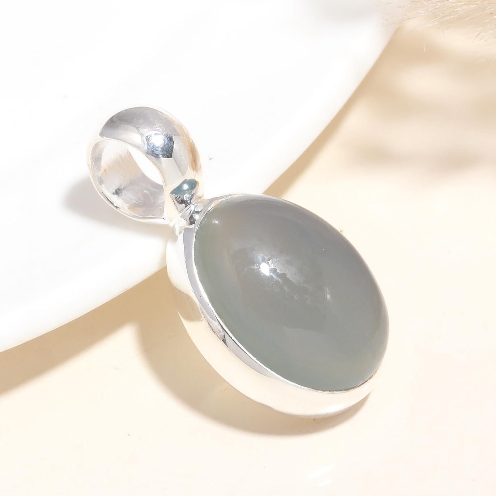 A 925 Sterling Silver Grey Moonstone Pendant with a handmade boho design, displayed against a neutral background.