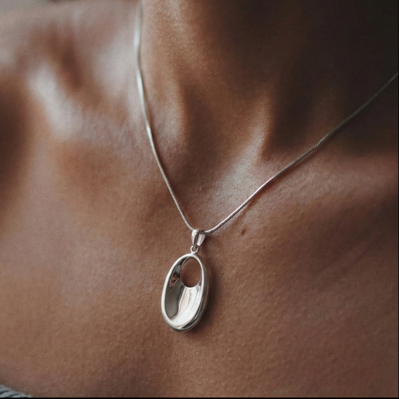 The Liquid Oval: Sculptural Sterling Silver Pendant