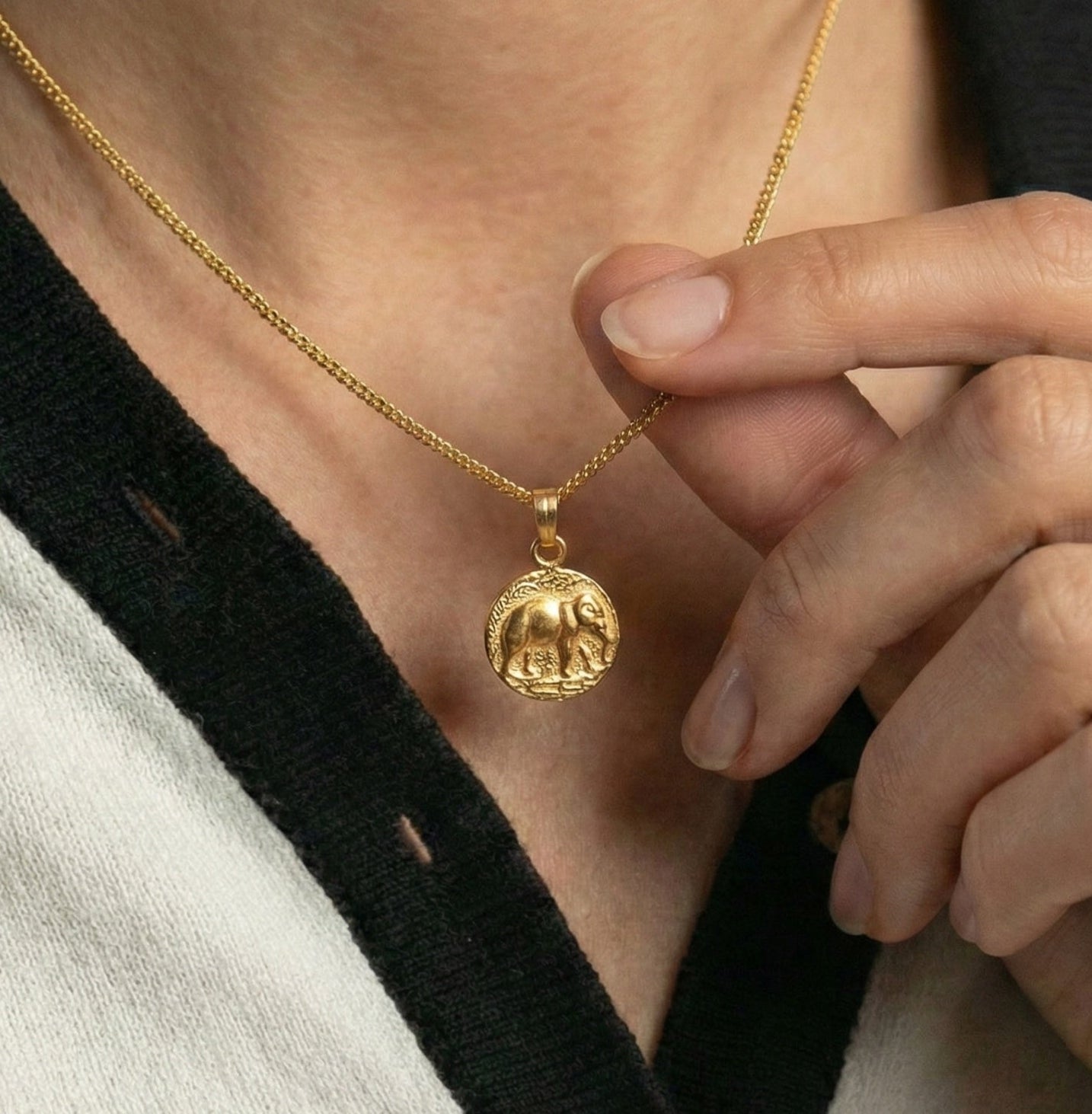 The Golden Guardian: Embossed Elephant Medallion