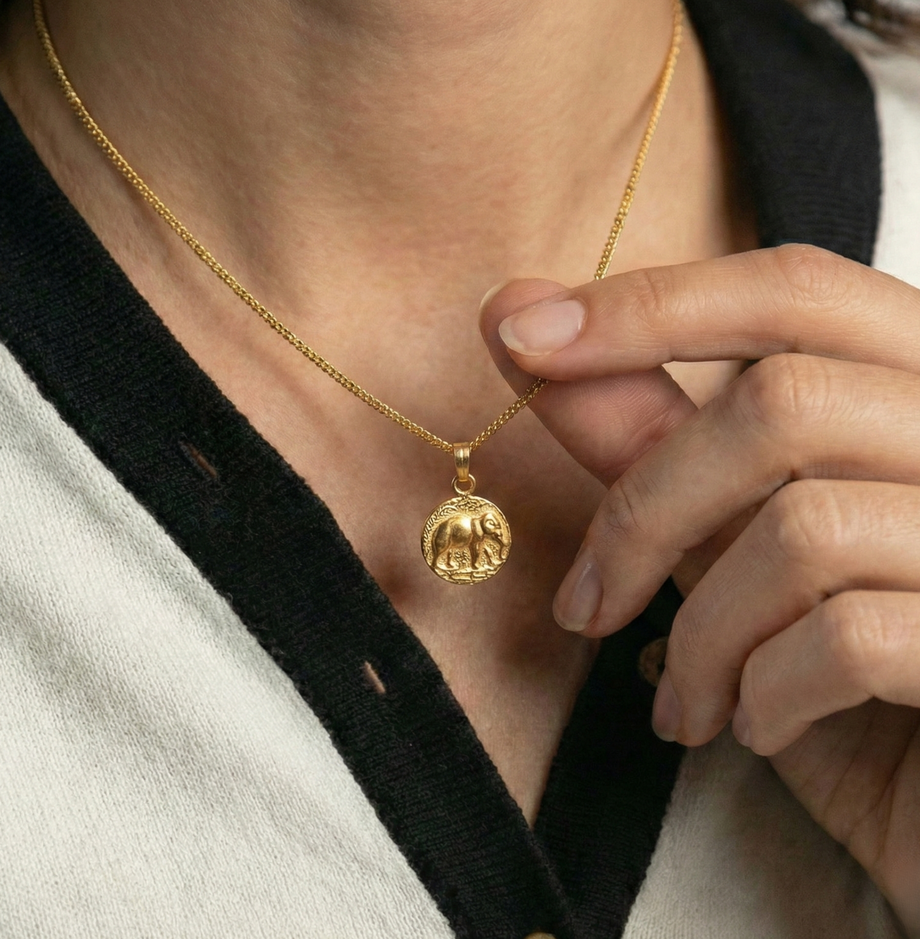 The Golden Guardian: Embossed Elephant Medallion