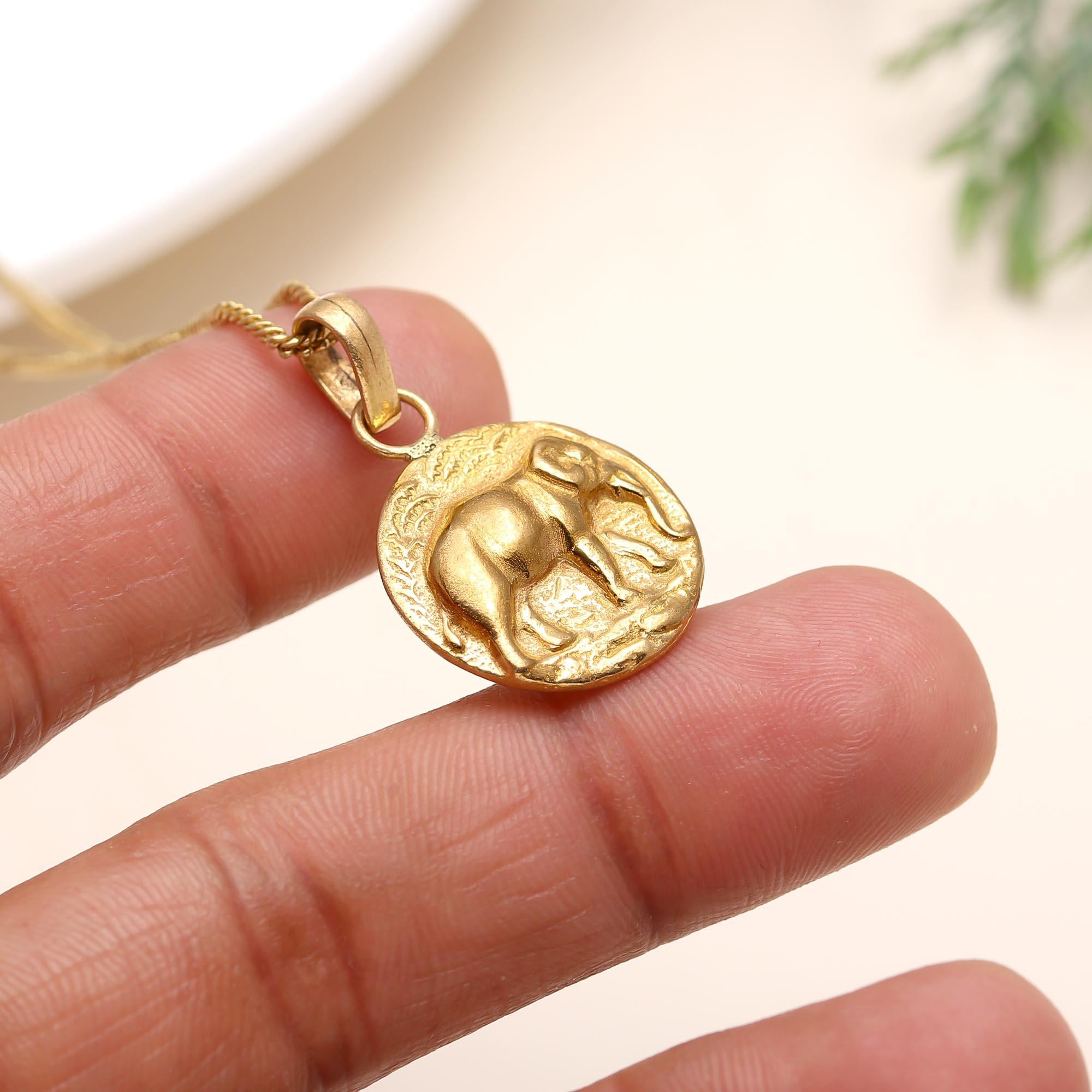 The Golden Guardian: Embossed Elephant Medallion