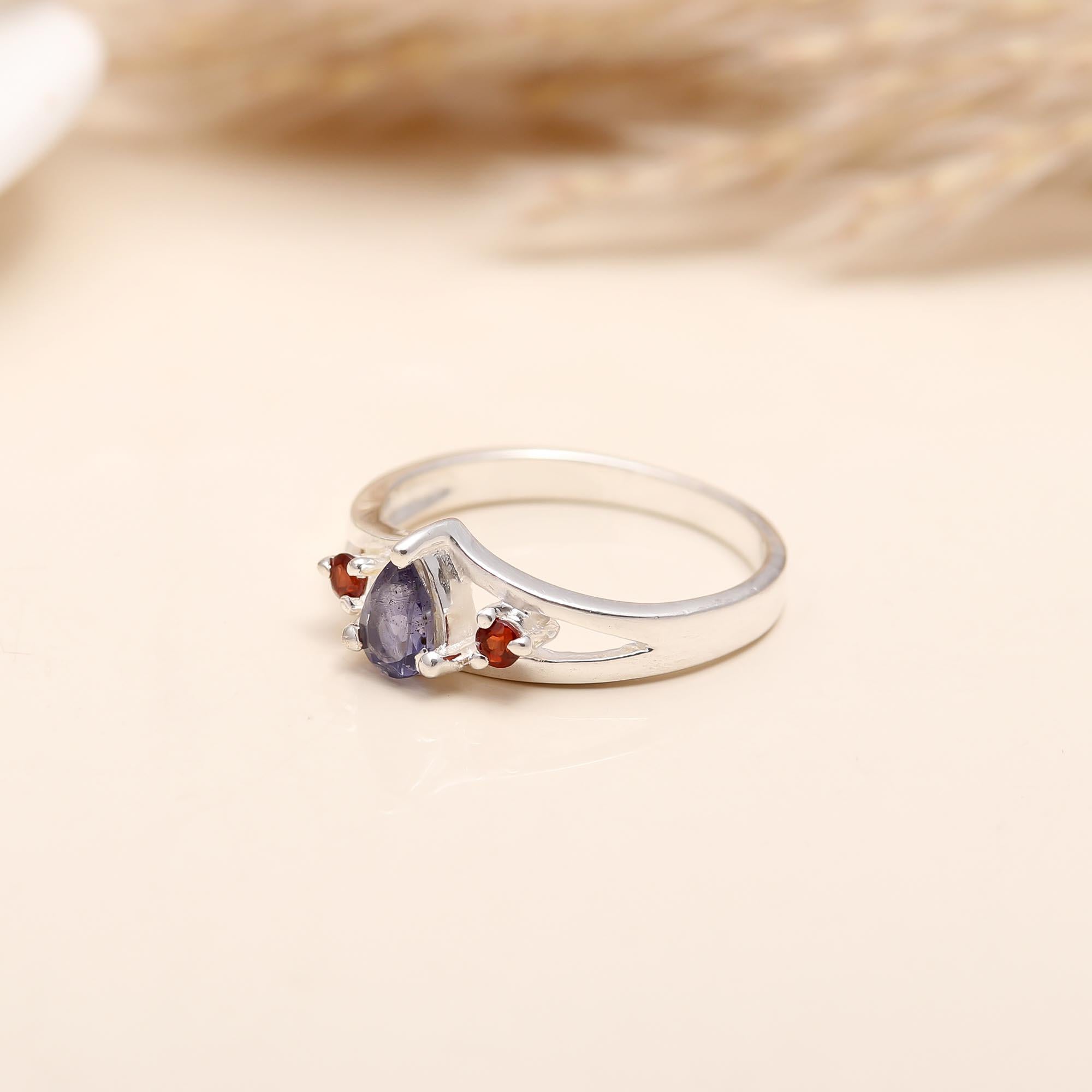 Detailed view of sterling silver ring with dual gemstones