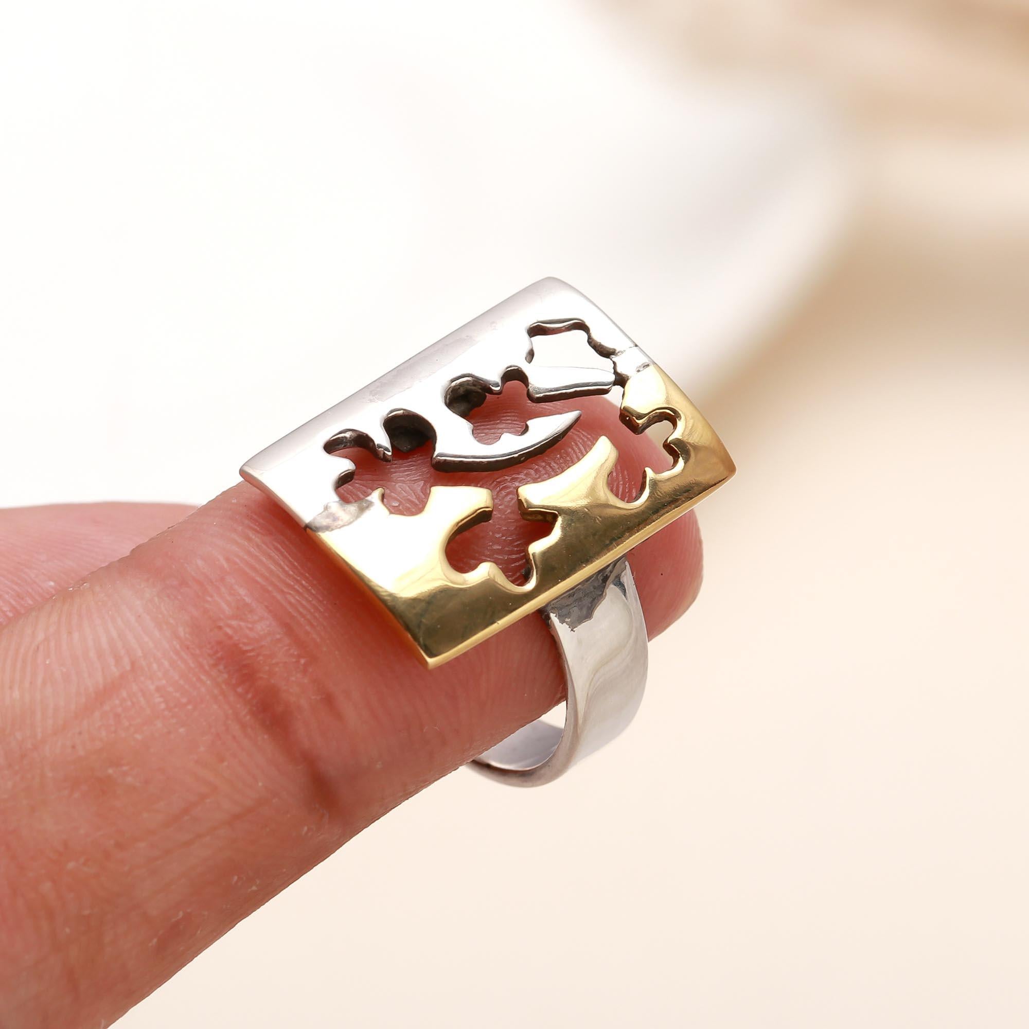 Elegant floral-inspired silver ring on finger