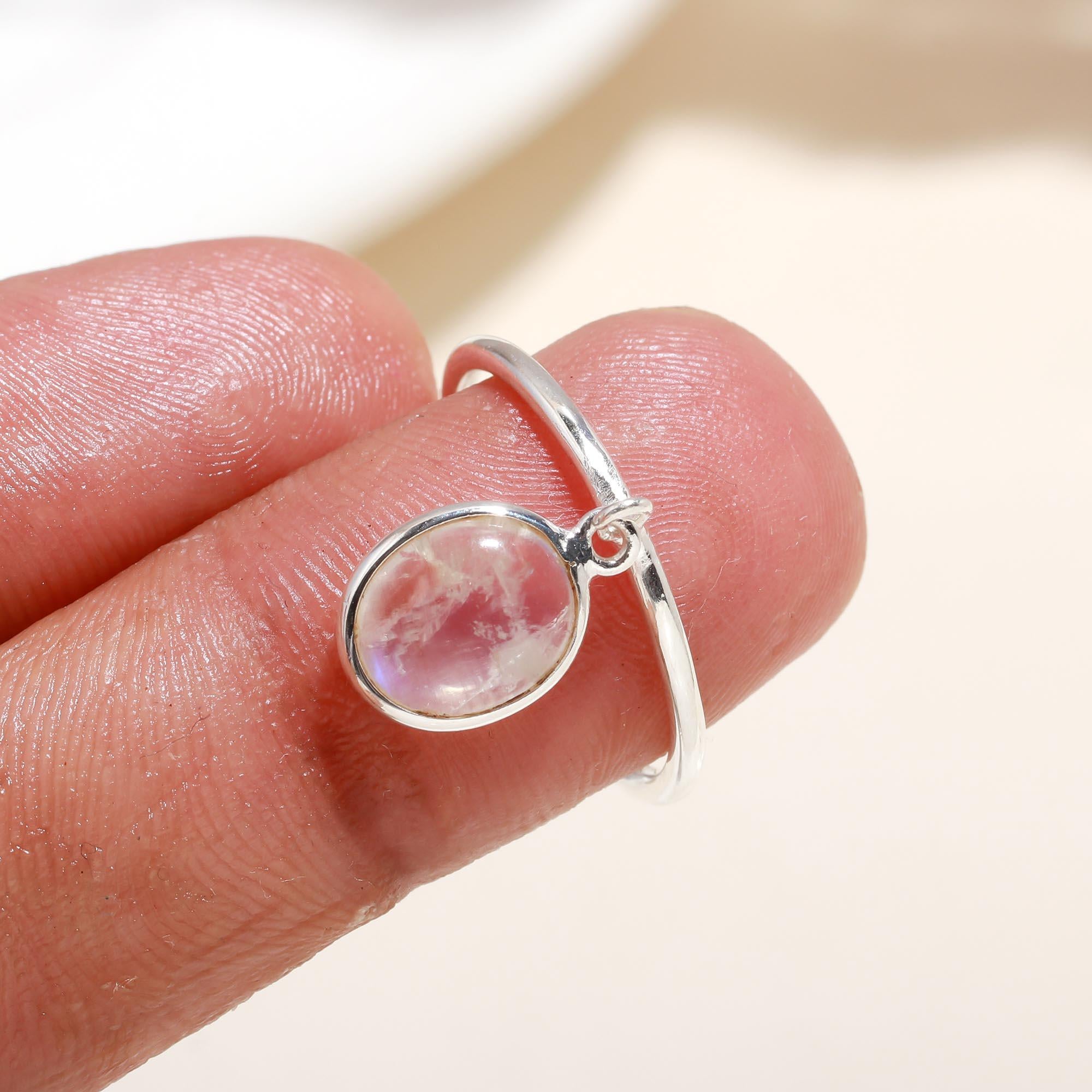Elegant moonstone drop ring on finger