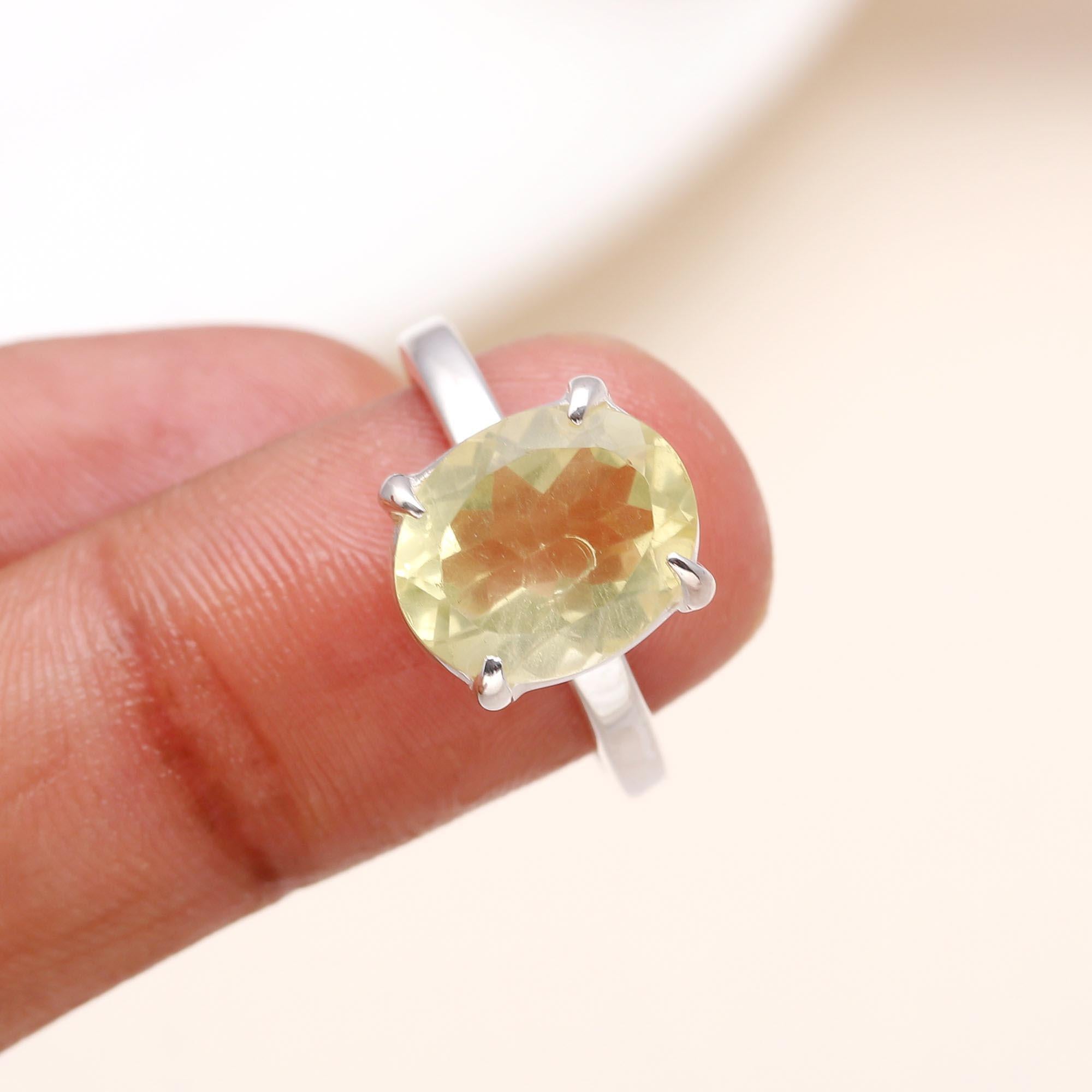 Elegant oval lemon quartz ring on finger