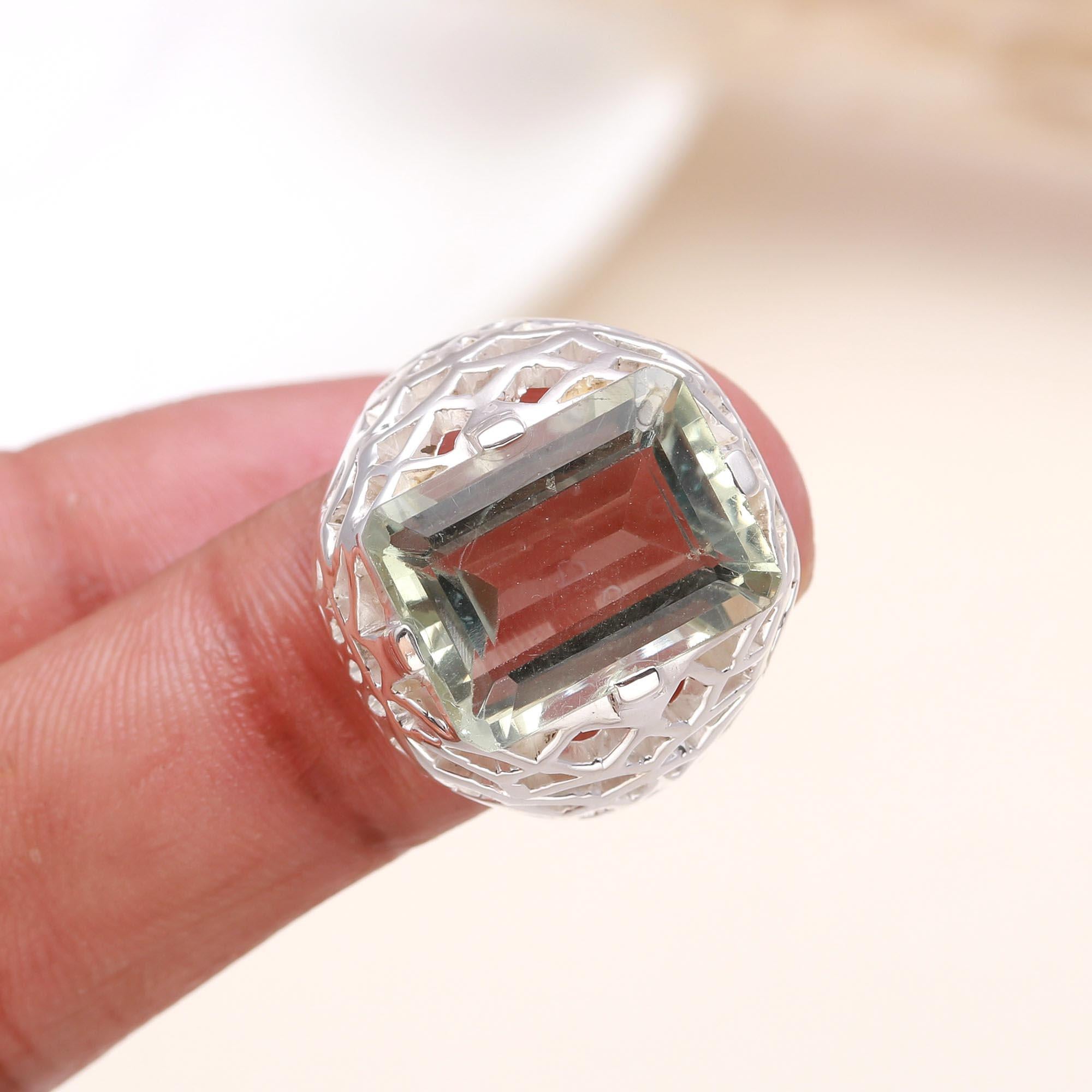 Elegant green amethyst filigree ring on finger