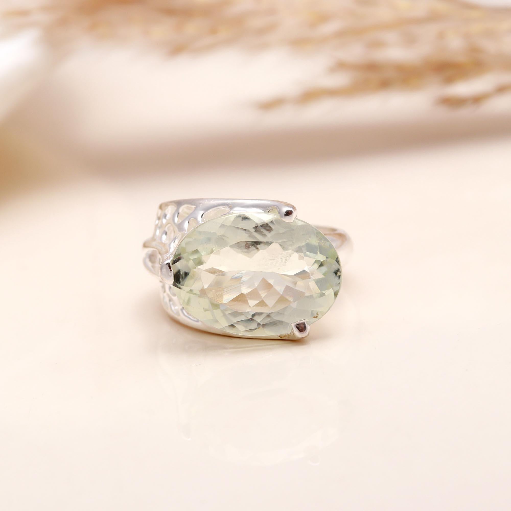 Close-up of oval green amethyst statement silver ring