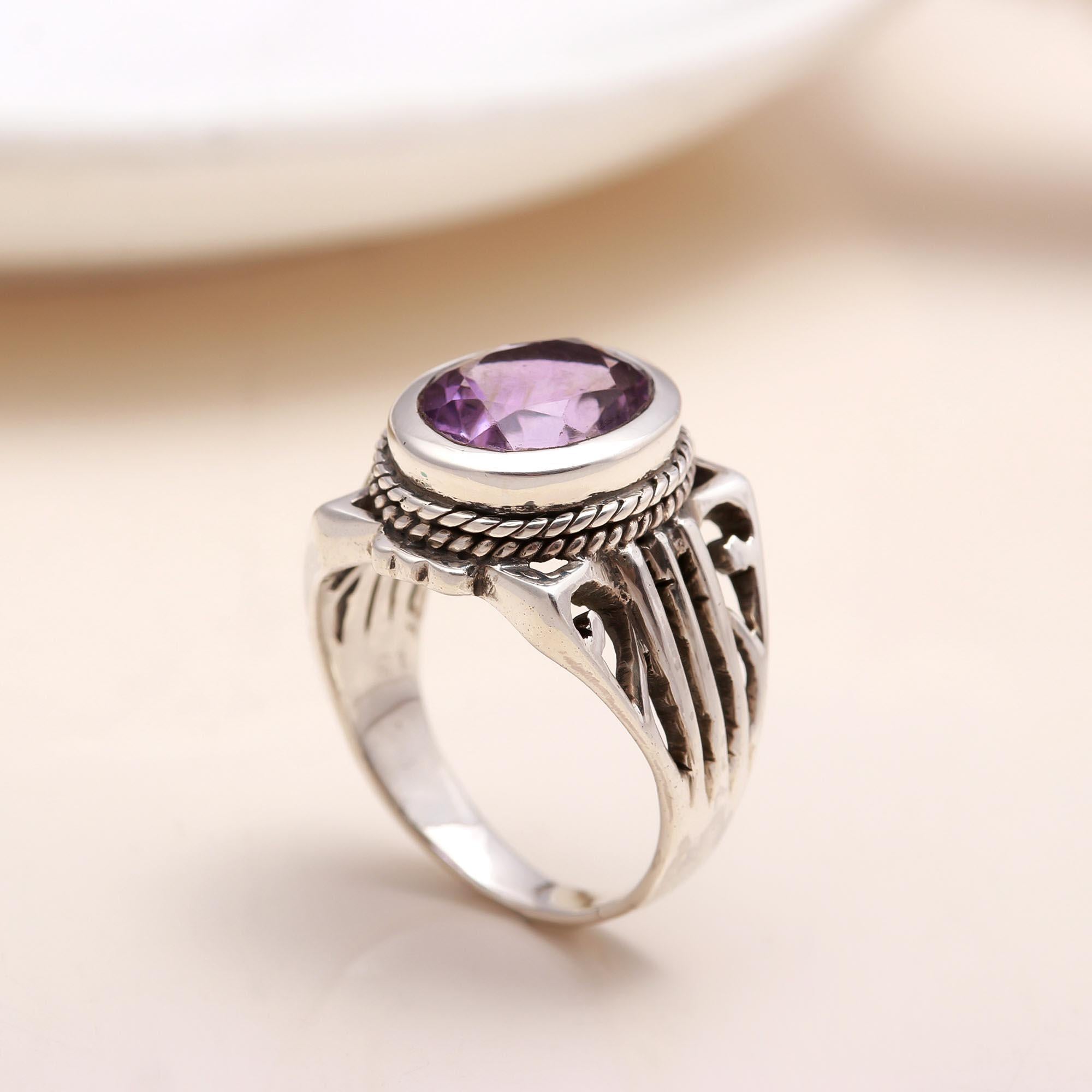 Oval-cut amethyst set in vintage sterling silver band
