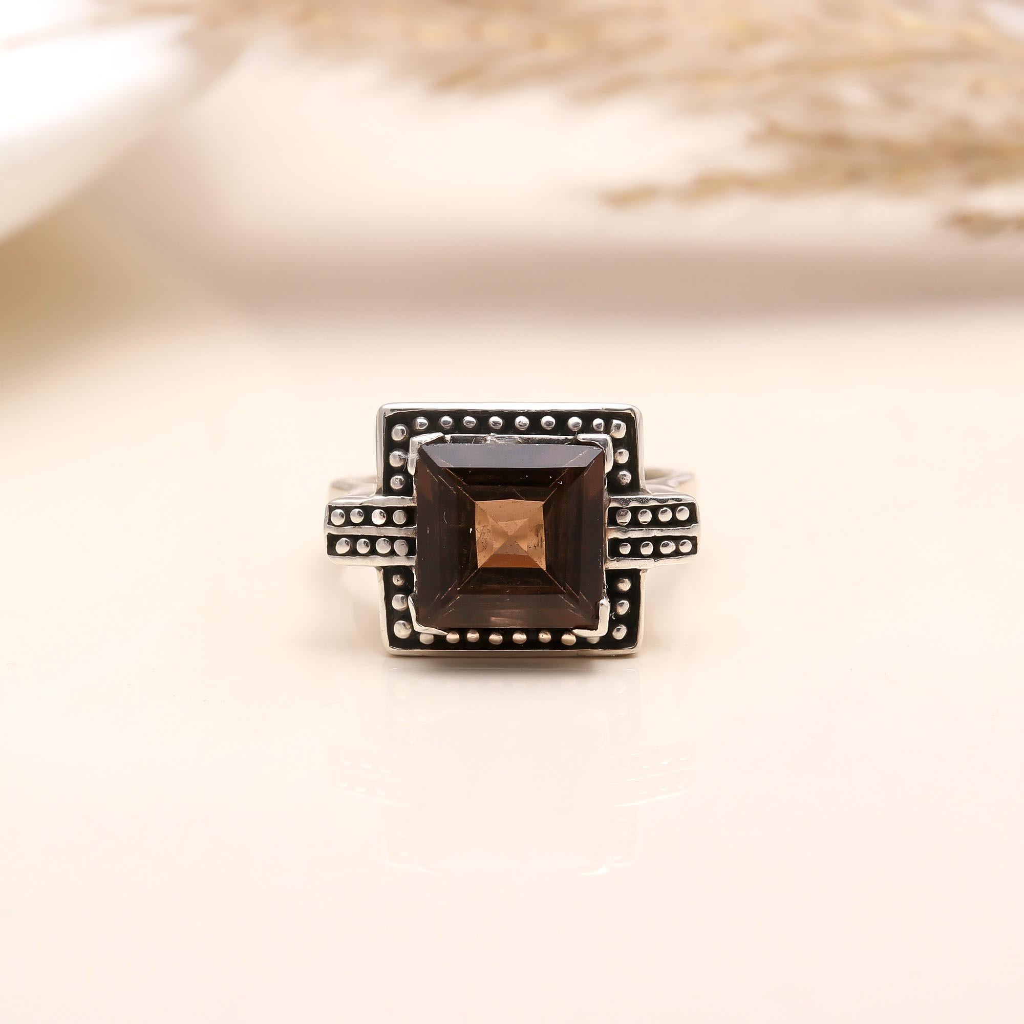 Square-cut garnet gemstone set in antique silver band
