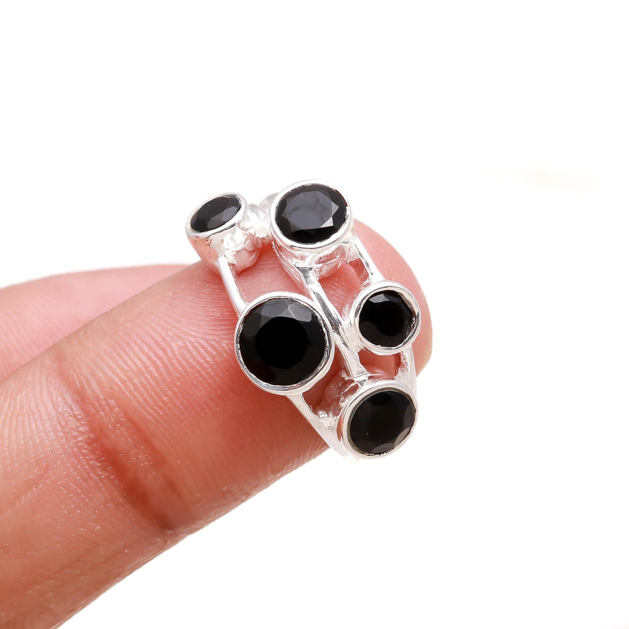 Elegant black onyx cocktail ring on finger