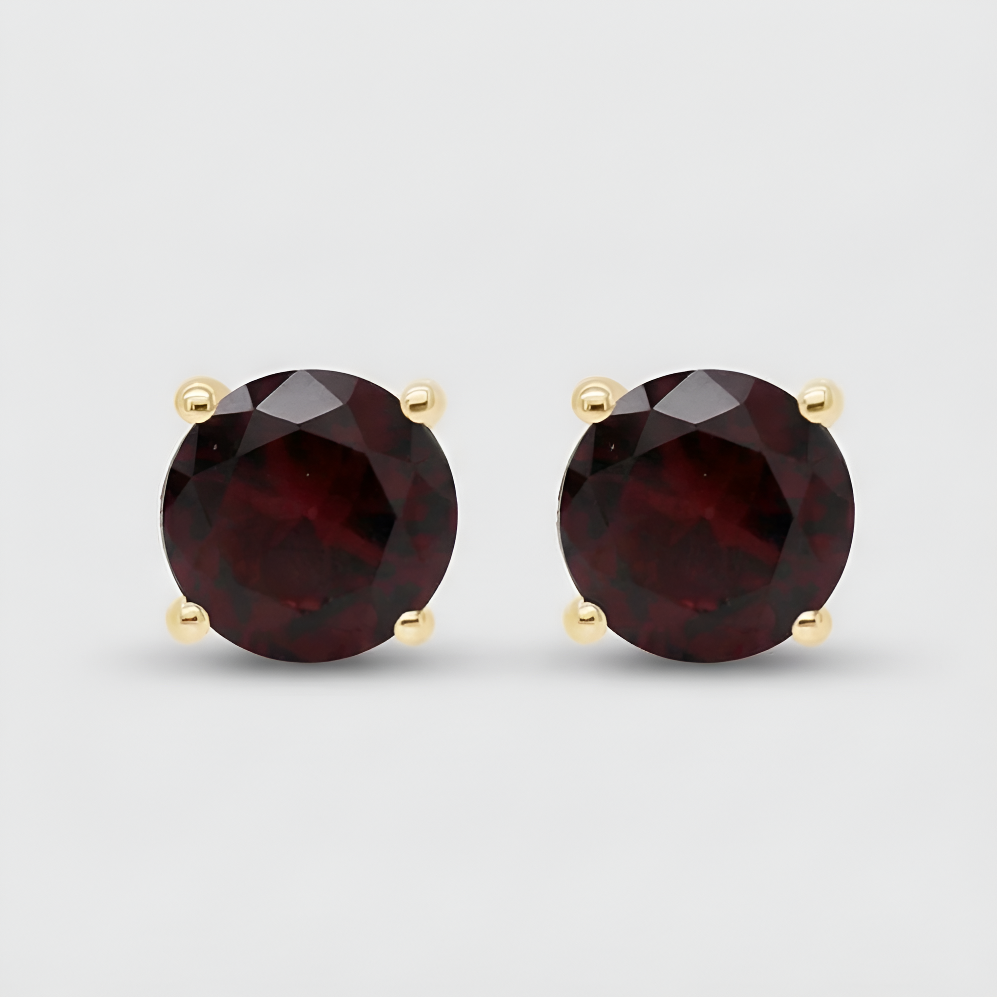 Classic Passion: Gold Plated Round Garnet Stud