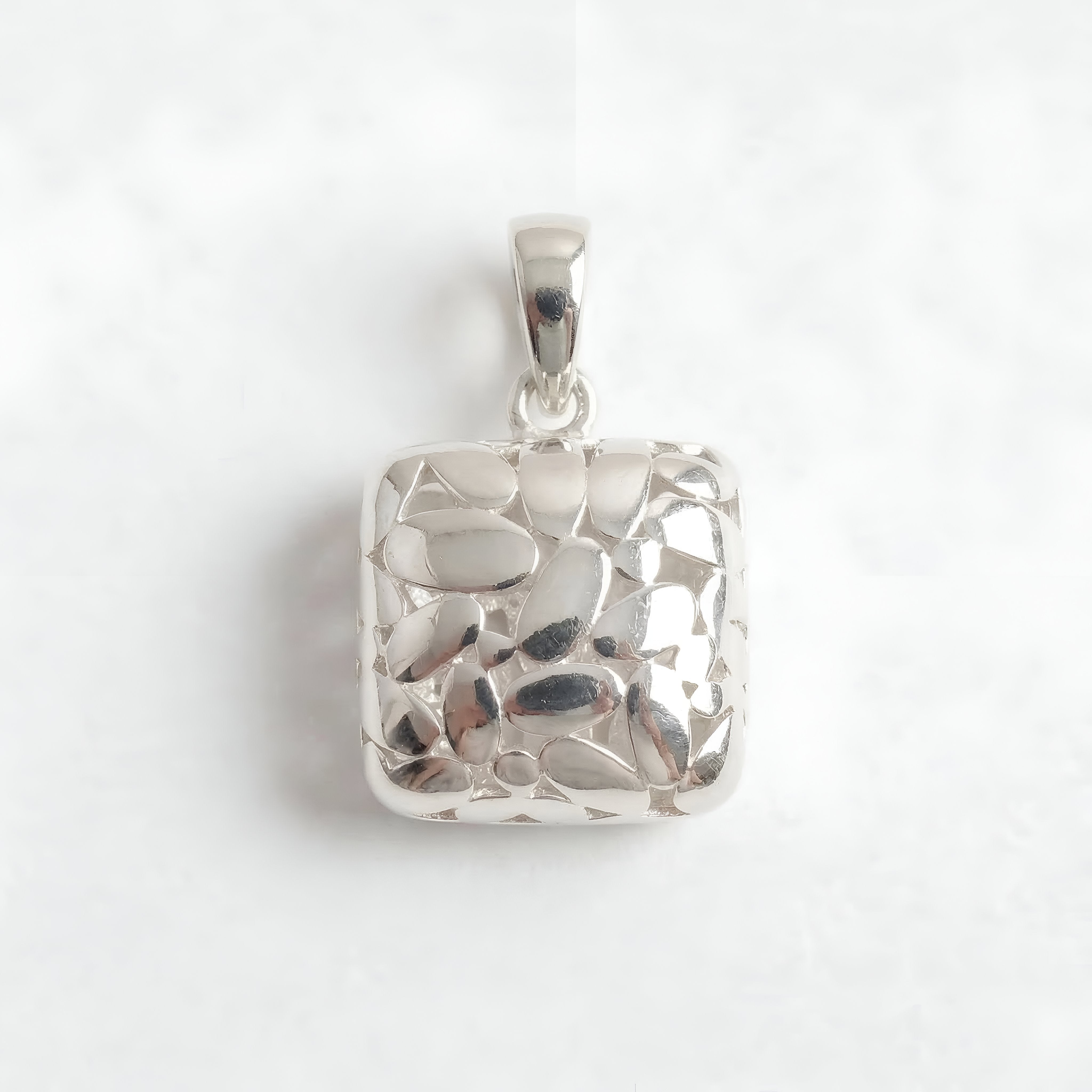 The Silver Mosaic: Abstract Cutout Pillow Pendant