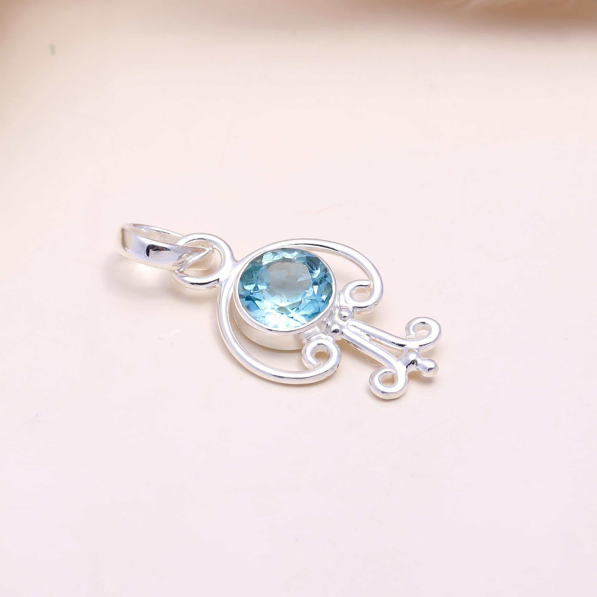 The Azure Key: Sky Blue Topaz Abstract Pendant