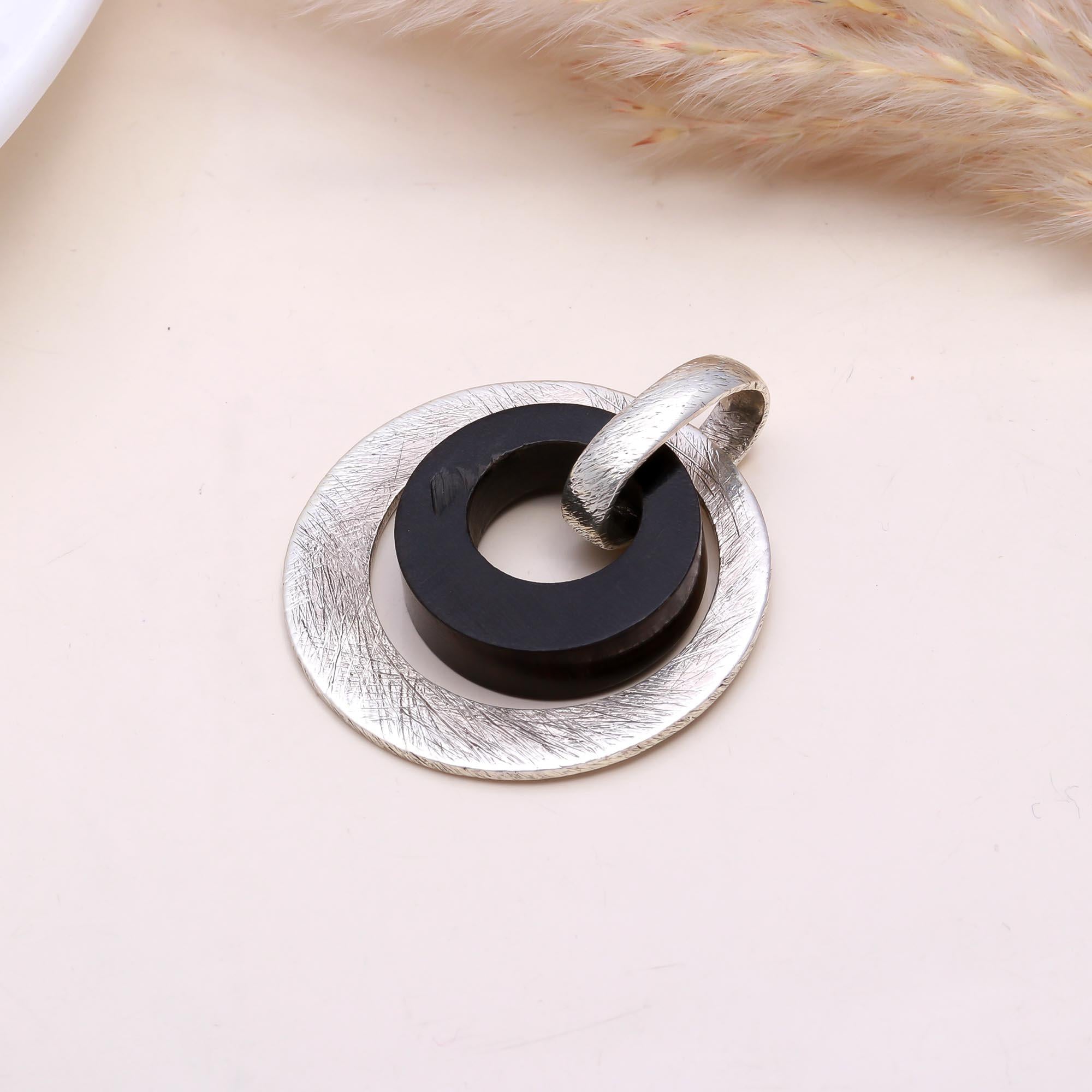 The Modern Halo Title: Silver & Black Wood Geometric Pendant