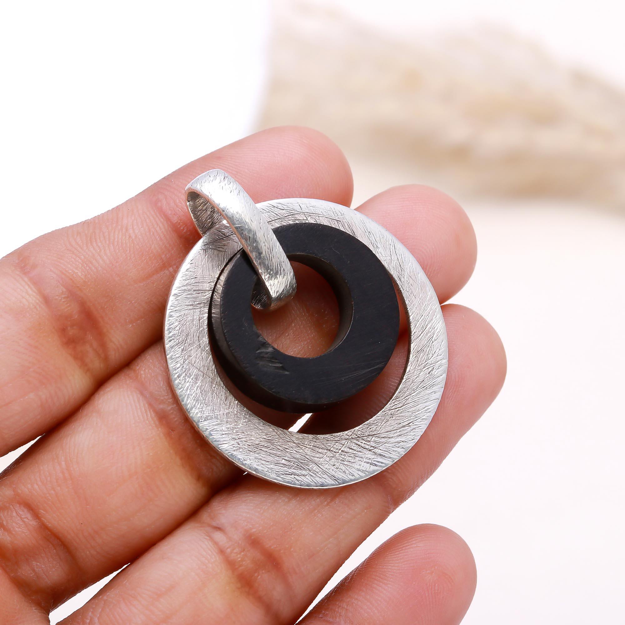 The Modern Halo Title: Silver & Black Wood Geometric Pendant