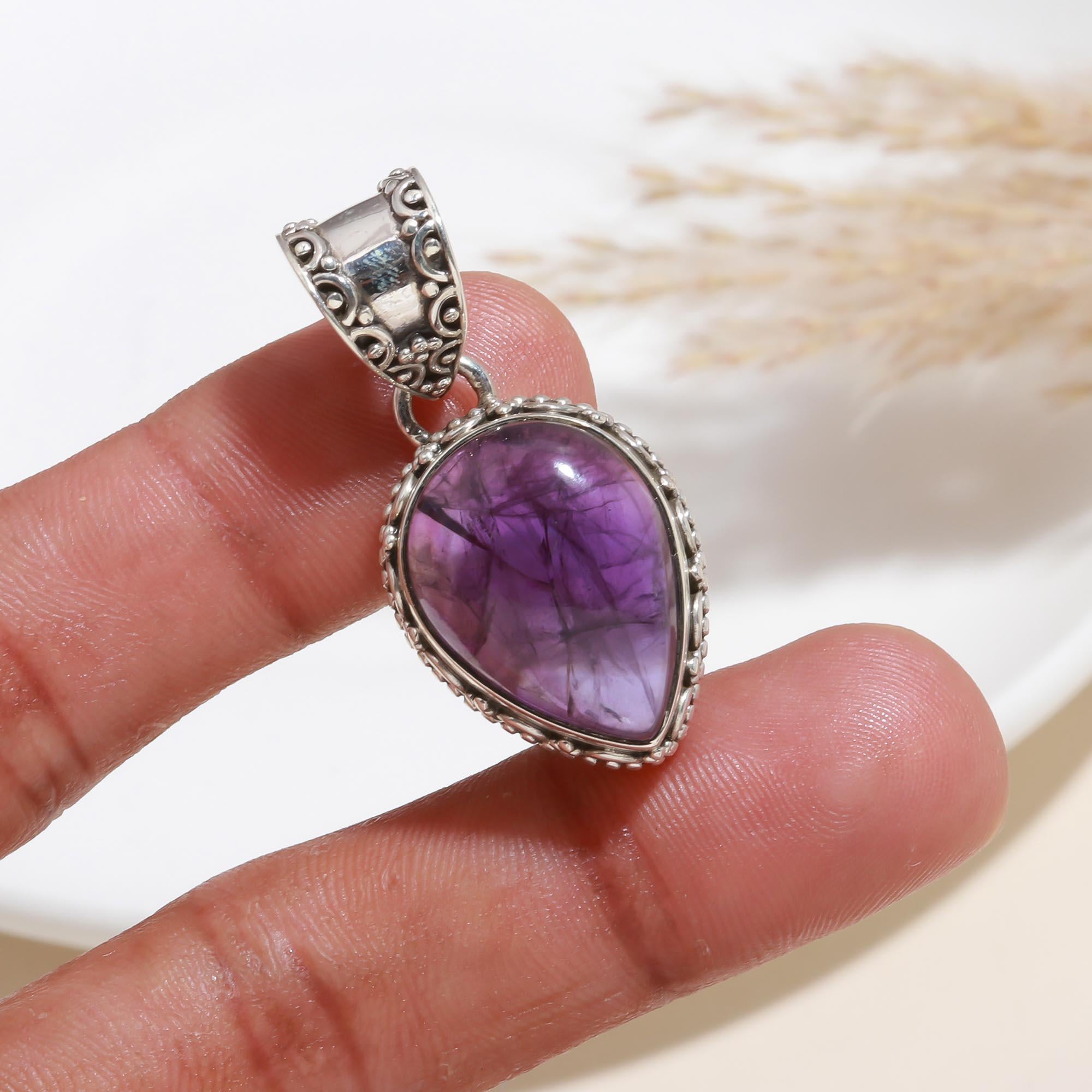 The Balinese Amethyst: Intricate Teardrop Silver Pendant
