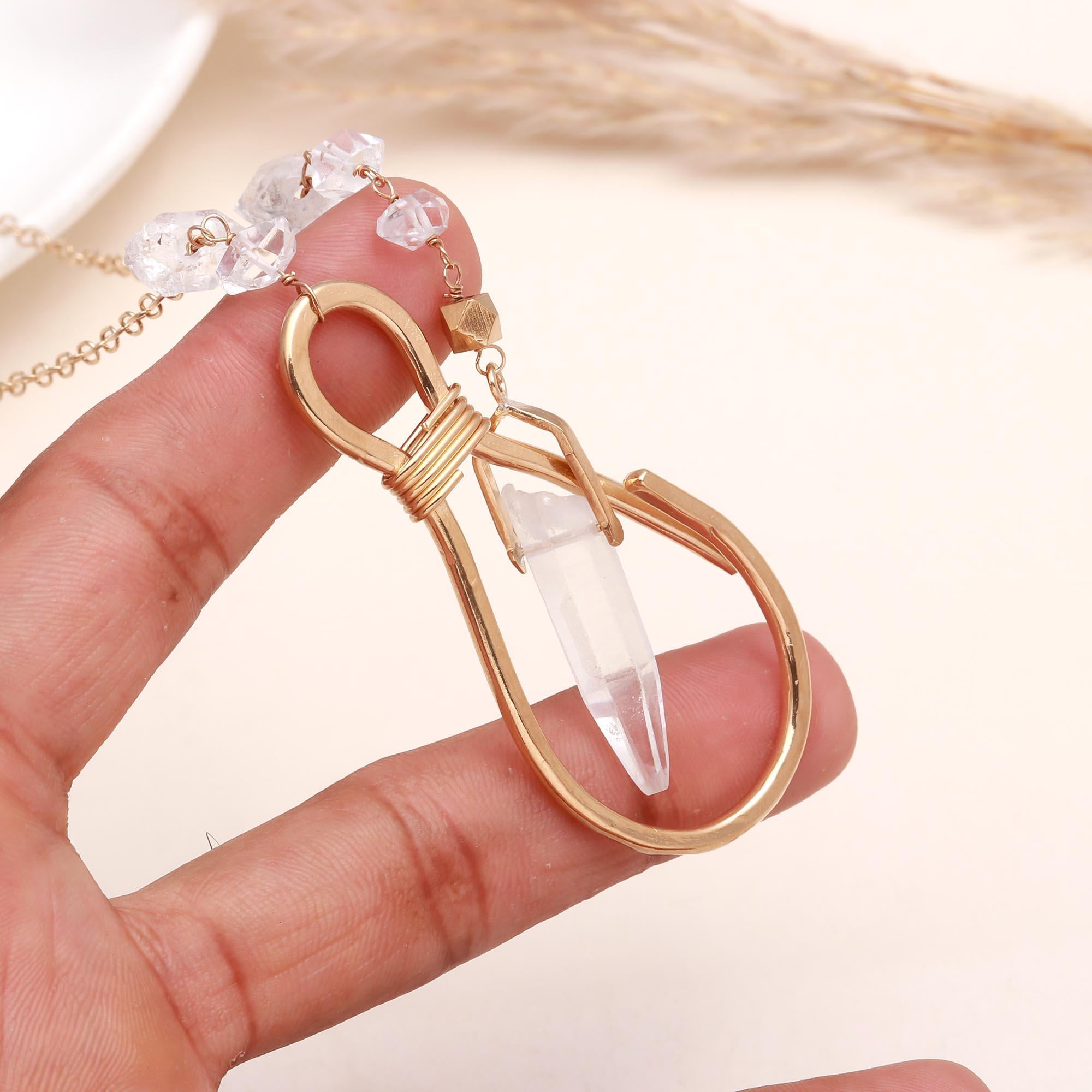 The Crystal Loop: Gold Wire Wrapped Raw Quartz Pendant