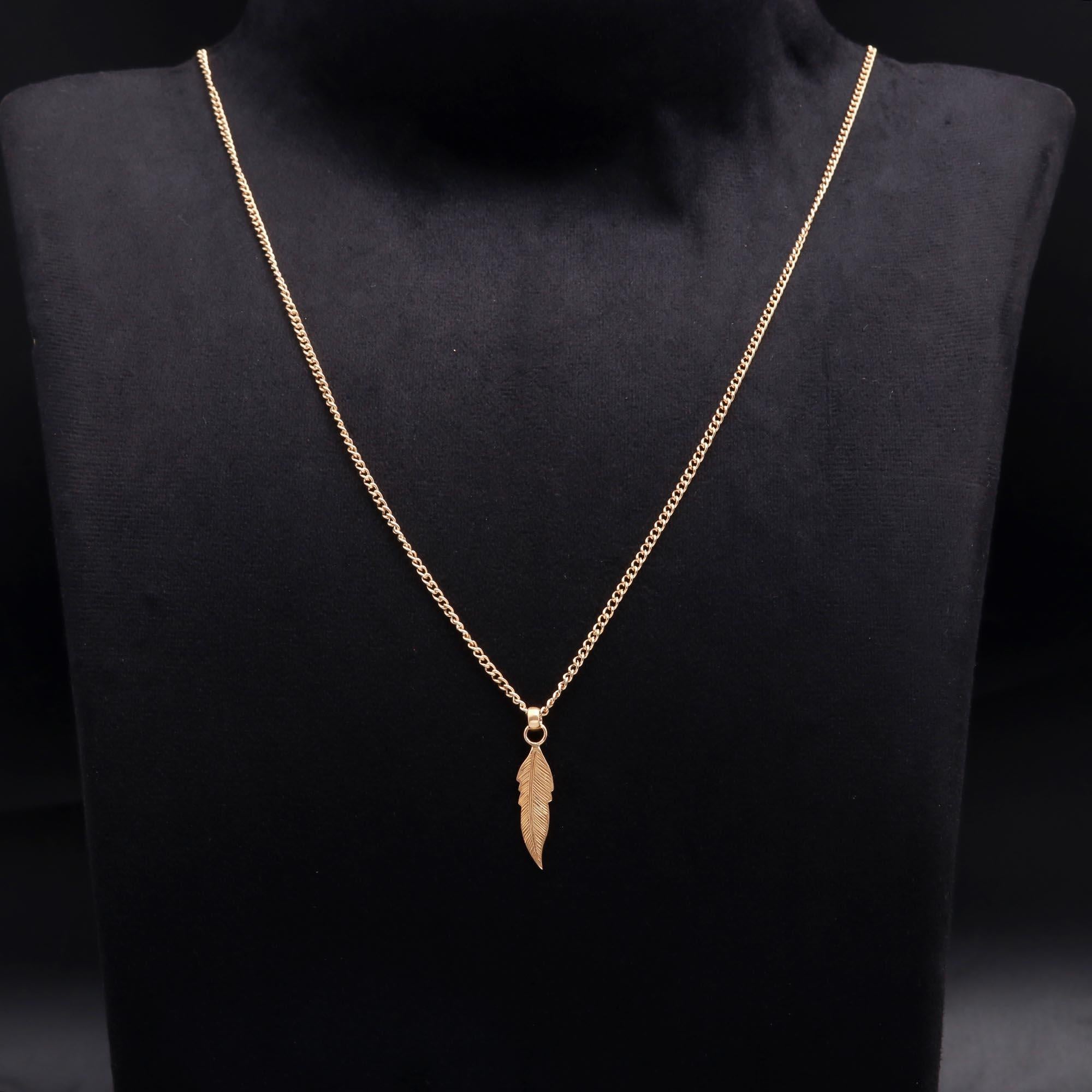 The Golden Quill: Detailed Gold Leaf Feather Pendant