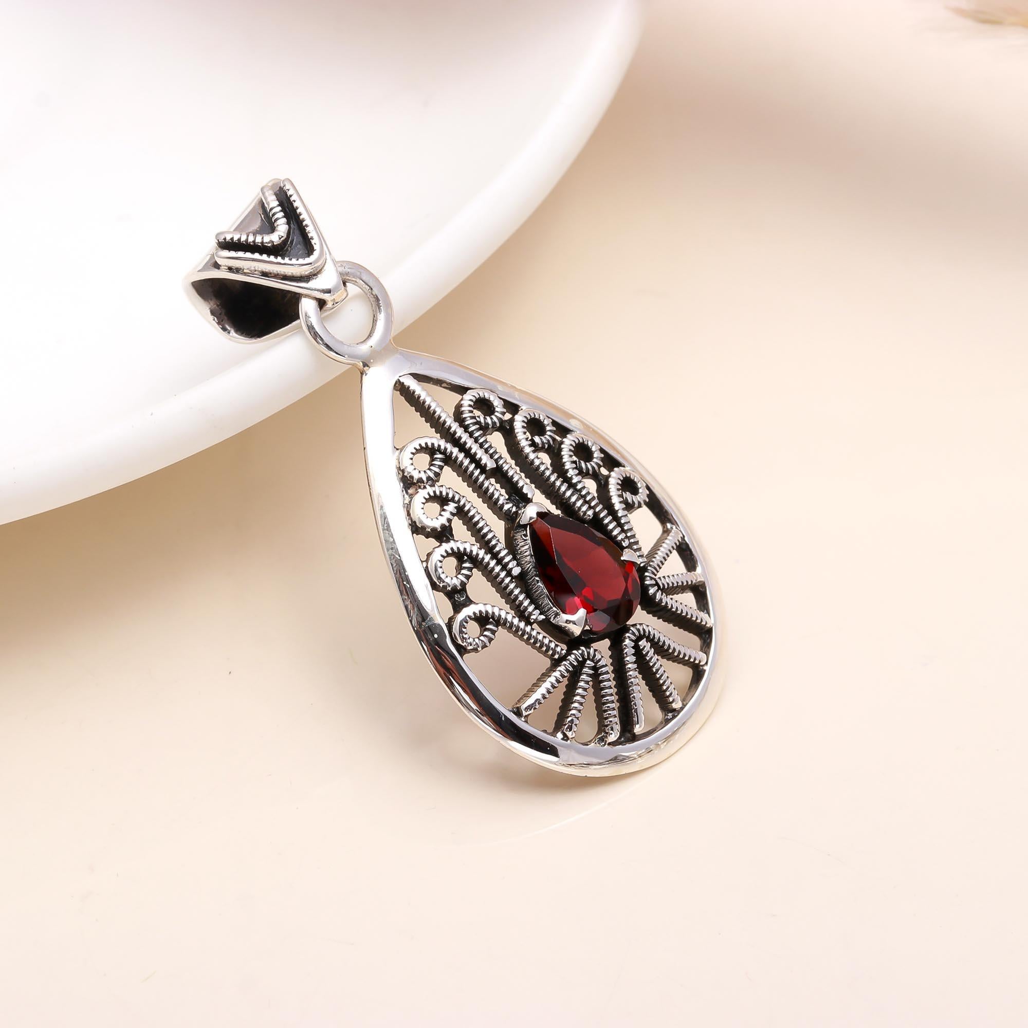 The Peacock Teardrop: Garnet Filigree Silver Pendant