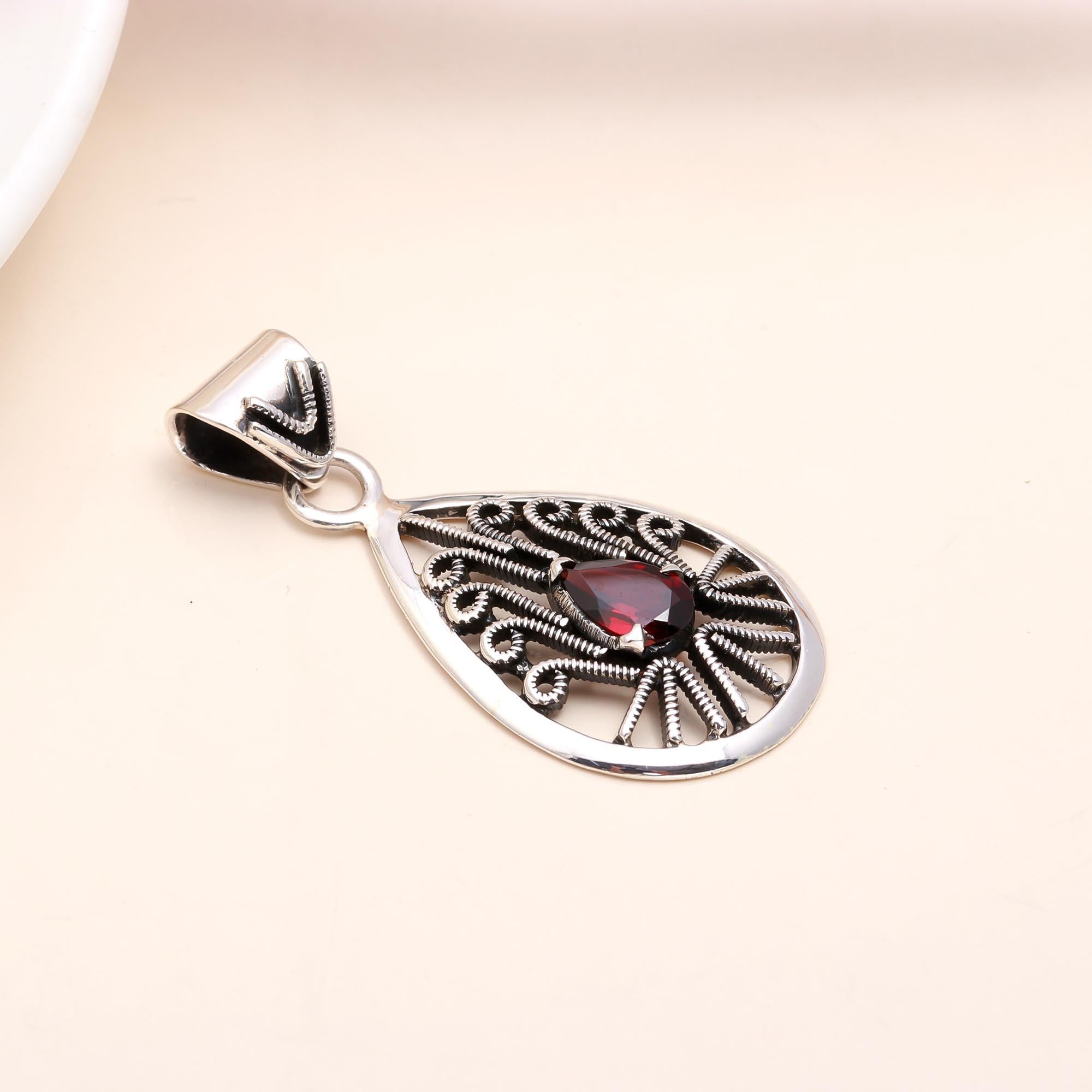 The Peacock Teardrop: Garnet Filigree Silver Pendant