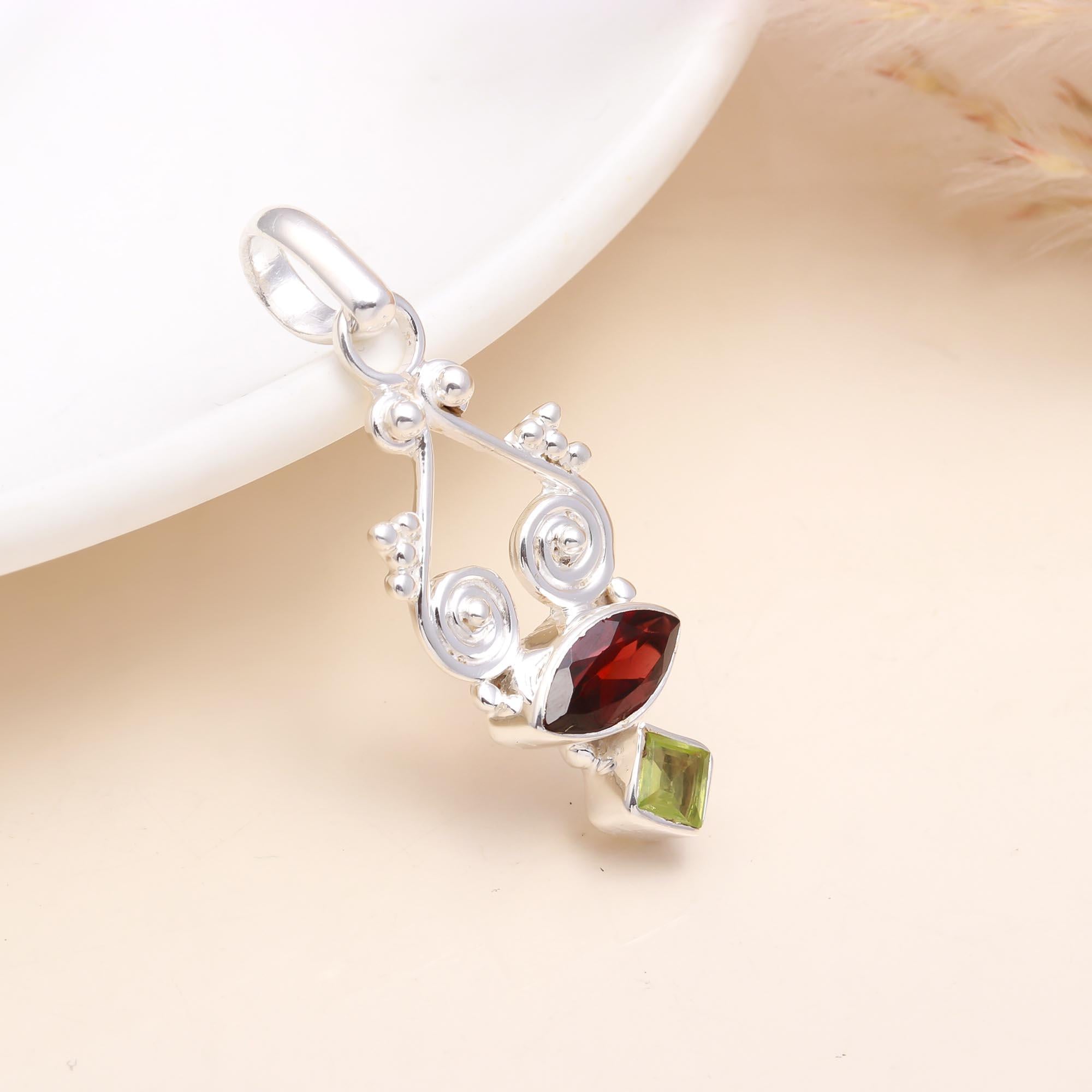 The Garnet Helix: Abstract Garnet & Peridot Silver Pendant