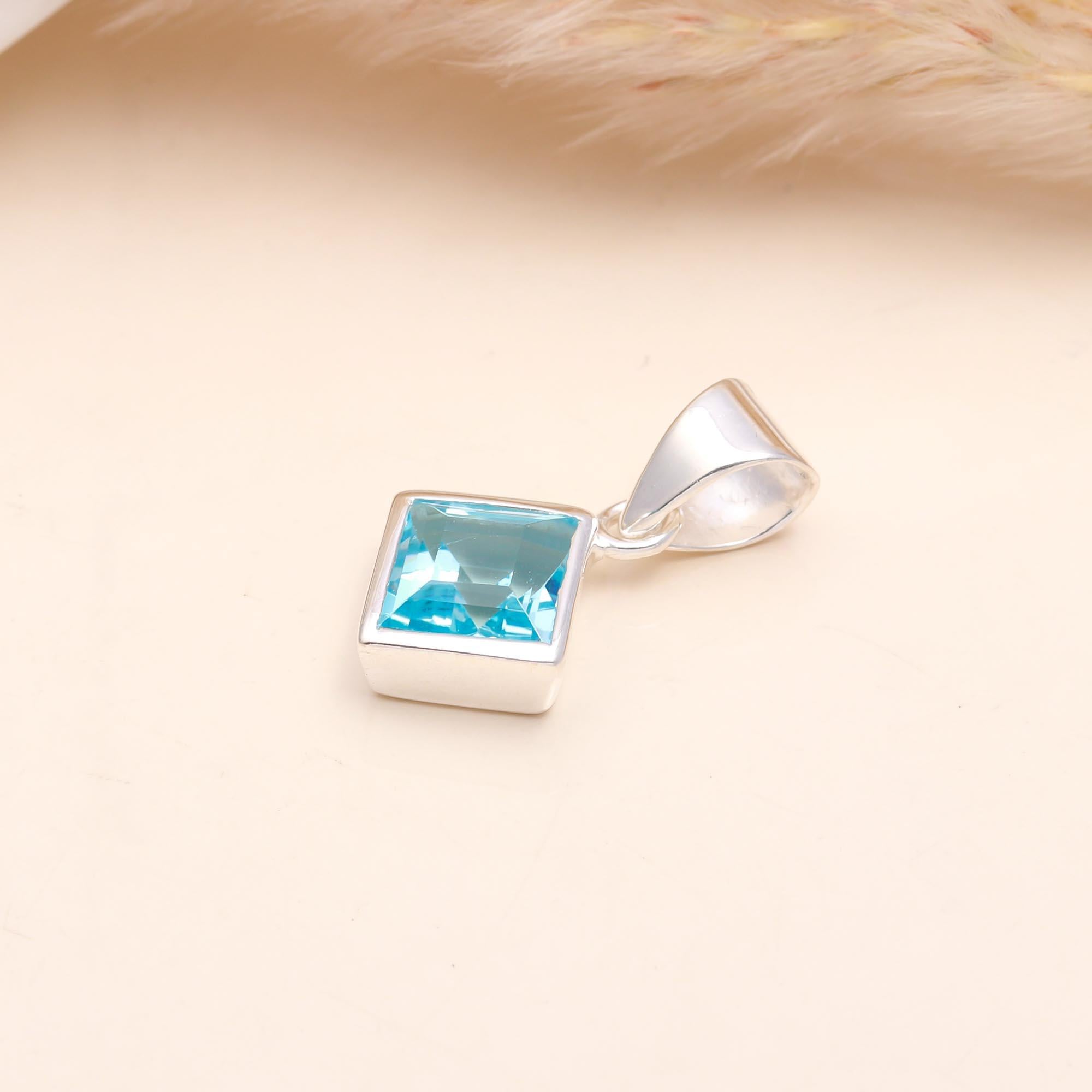 The Blue Tablet: Blue Topaz Silver Charm
