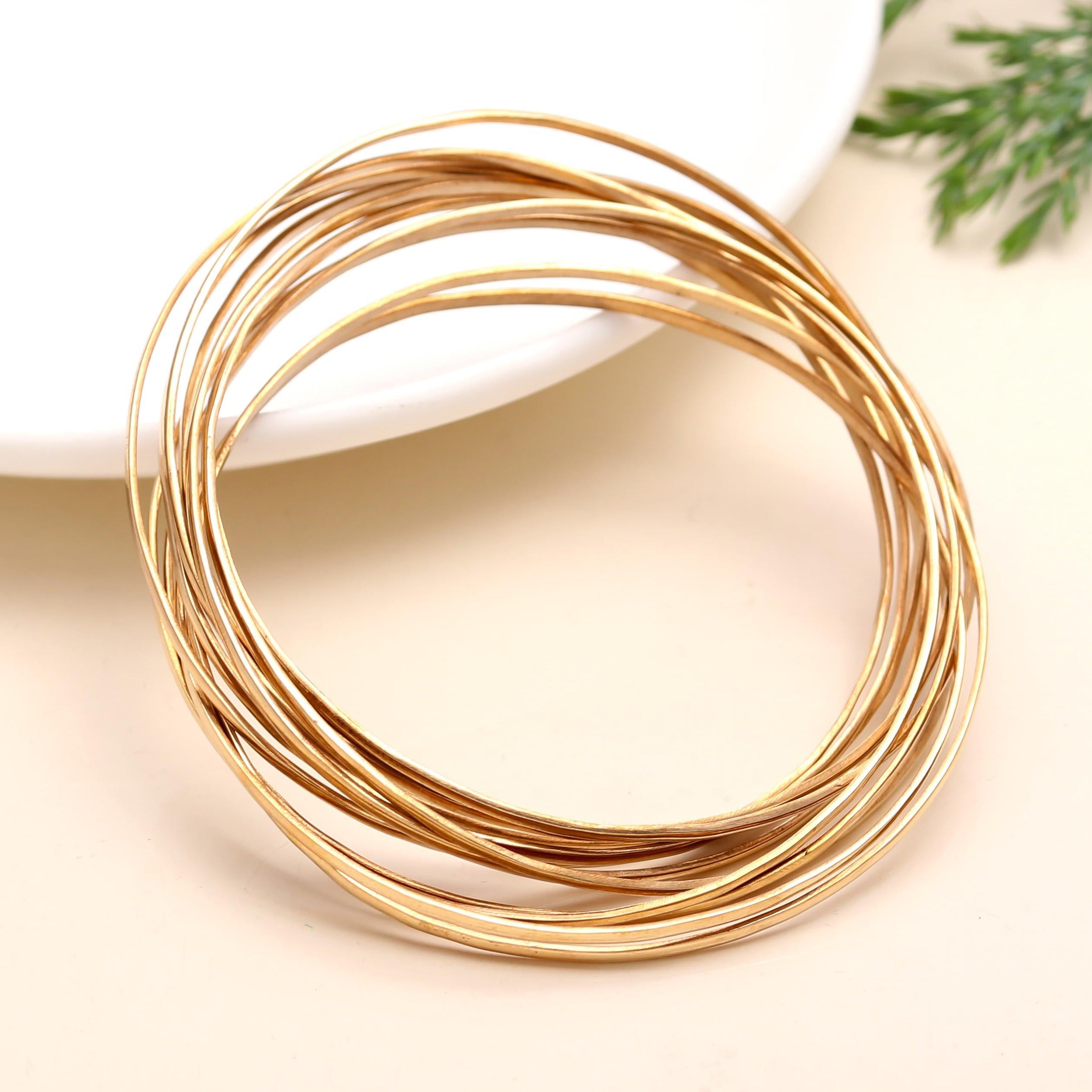 The Golden Cascade: Multi-Strand Gold Bangle Set