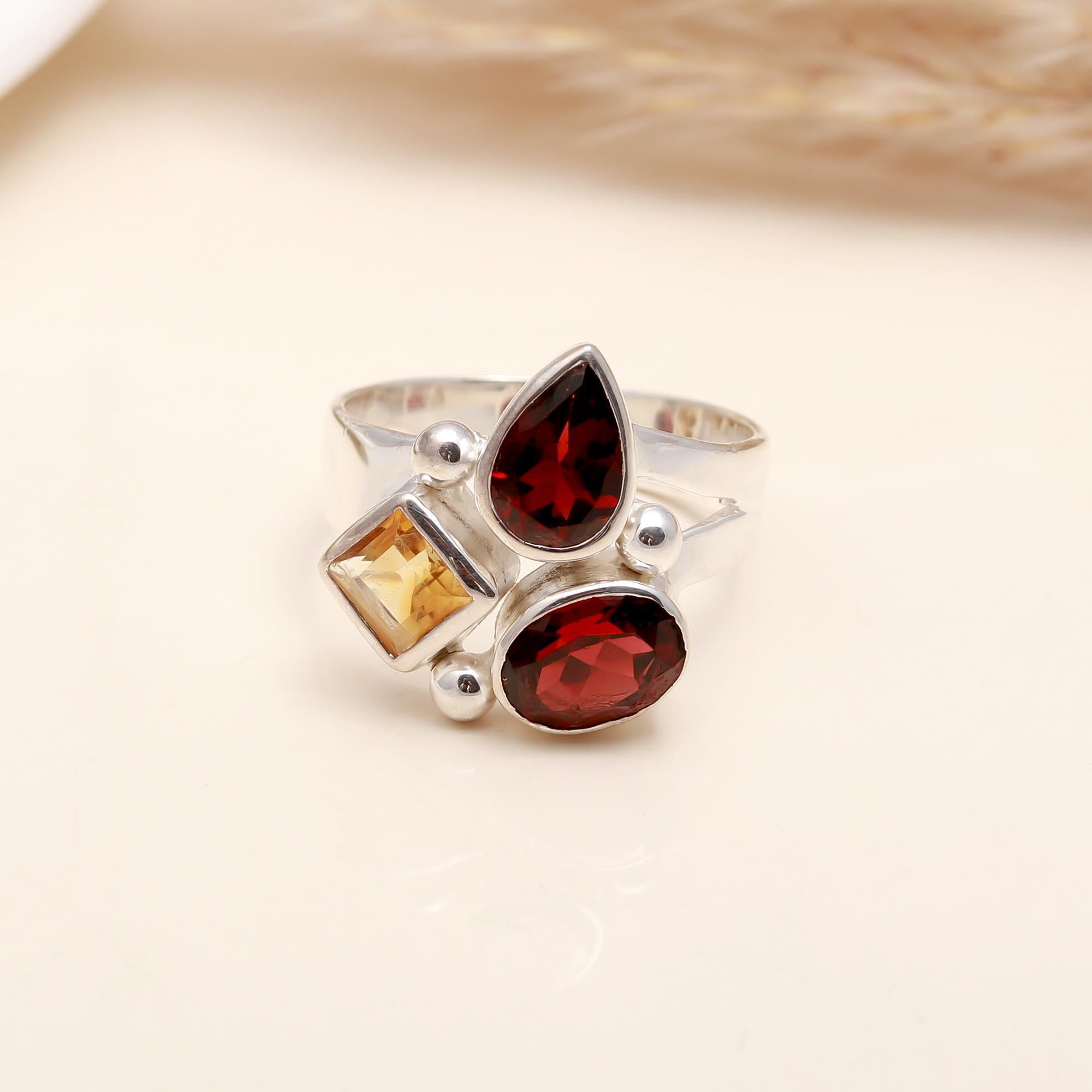 Hand model wearing 925 silver garnet and citrine multi-shape ring