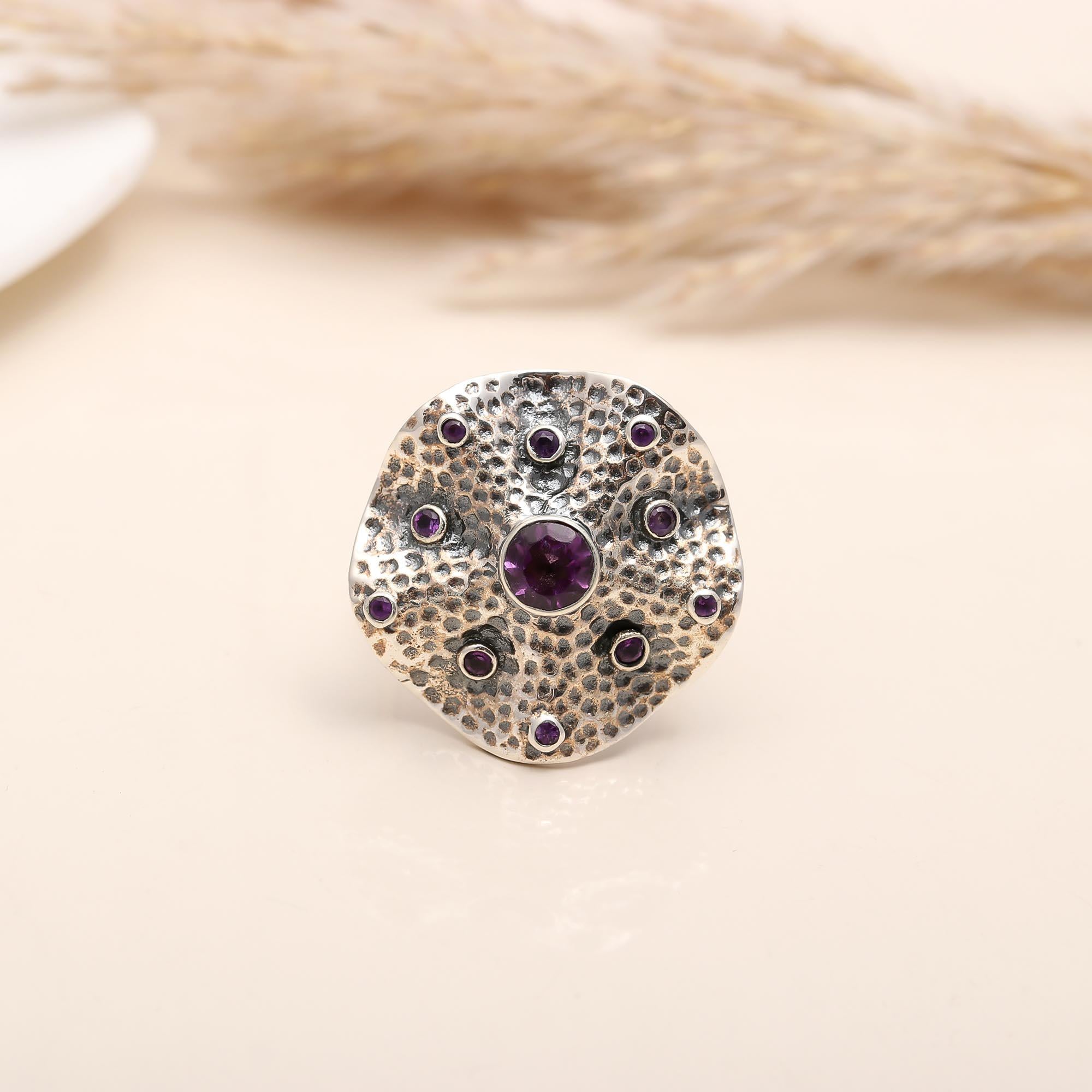 Bold textured silver ring with amethyst accents