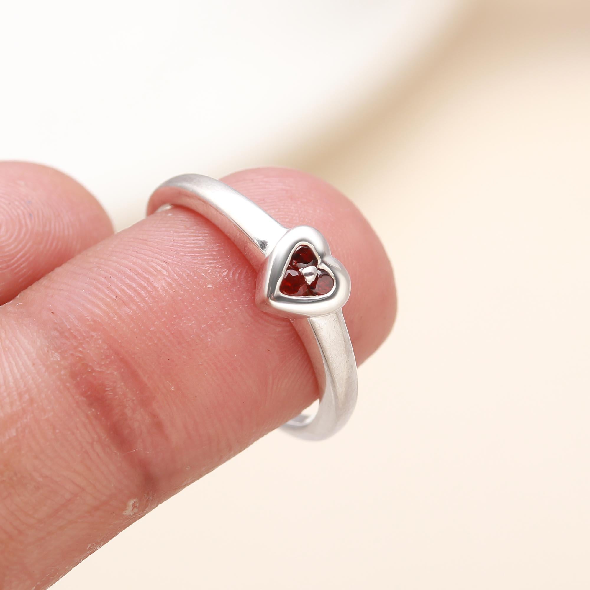 Romantic garnet heart gemstone ring with silver band